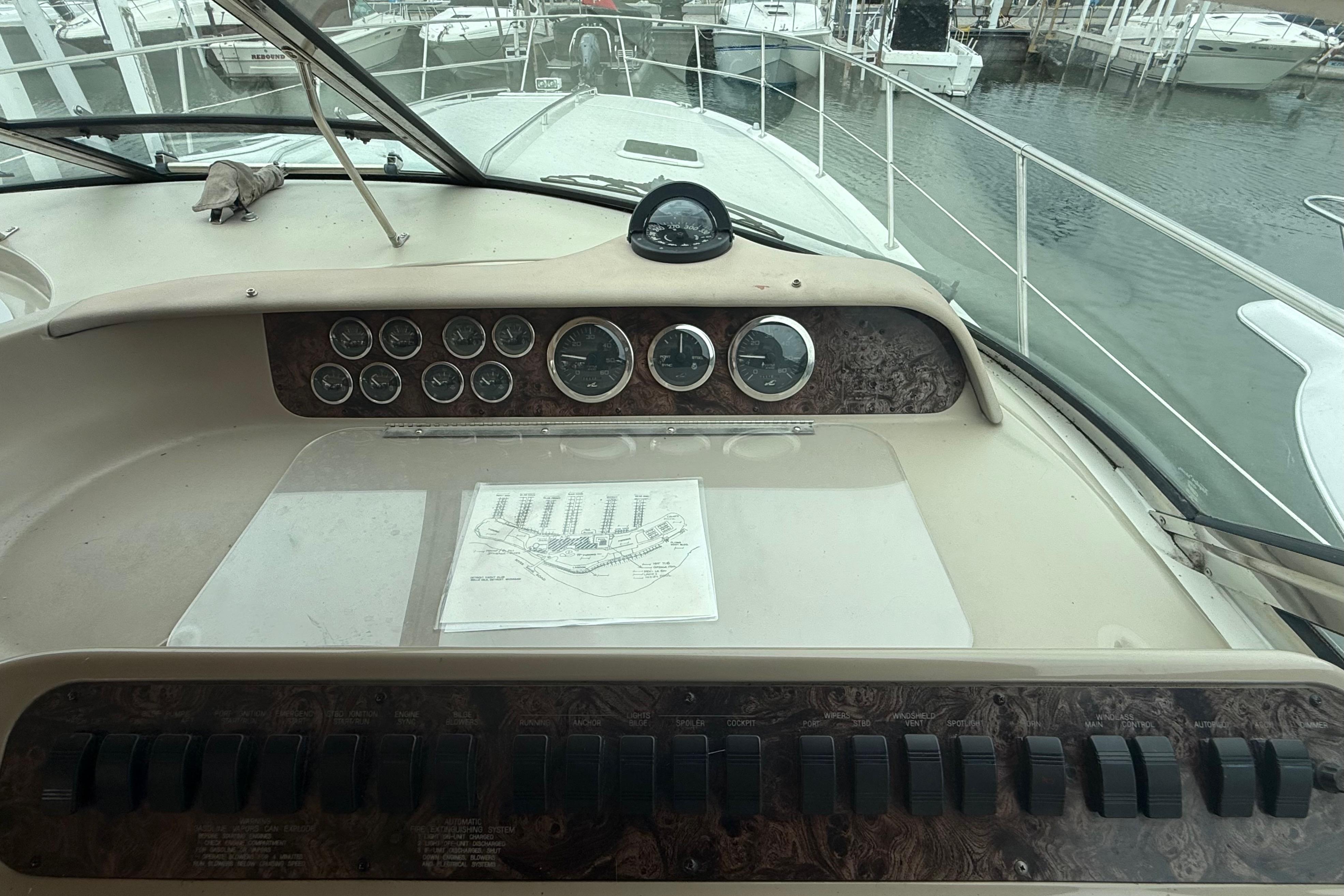 Control panel of a 1998 Sea Ray Sundancer 400 yacht at a marina.