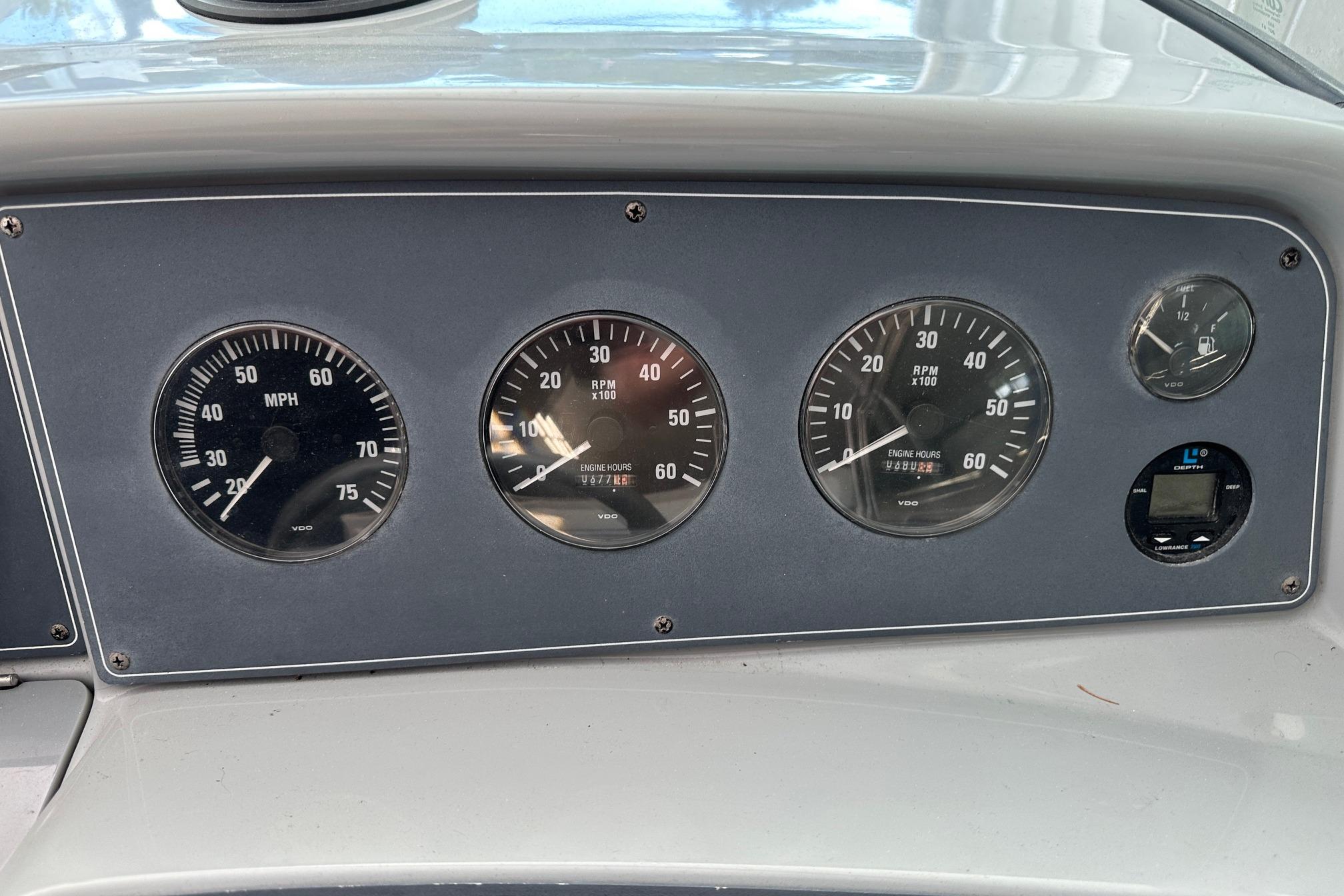Dashboard of a 1997 Formula 330 Sun Sport boat with speedometer and RPM gauges.
