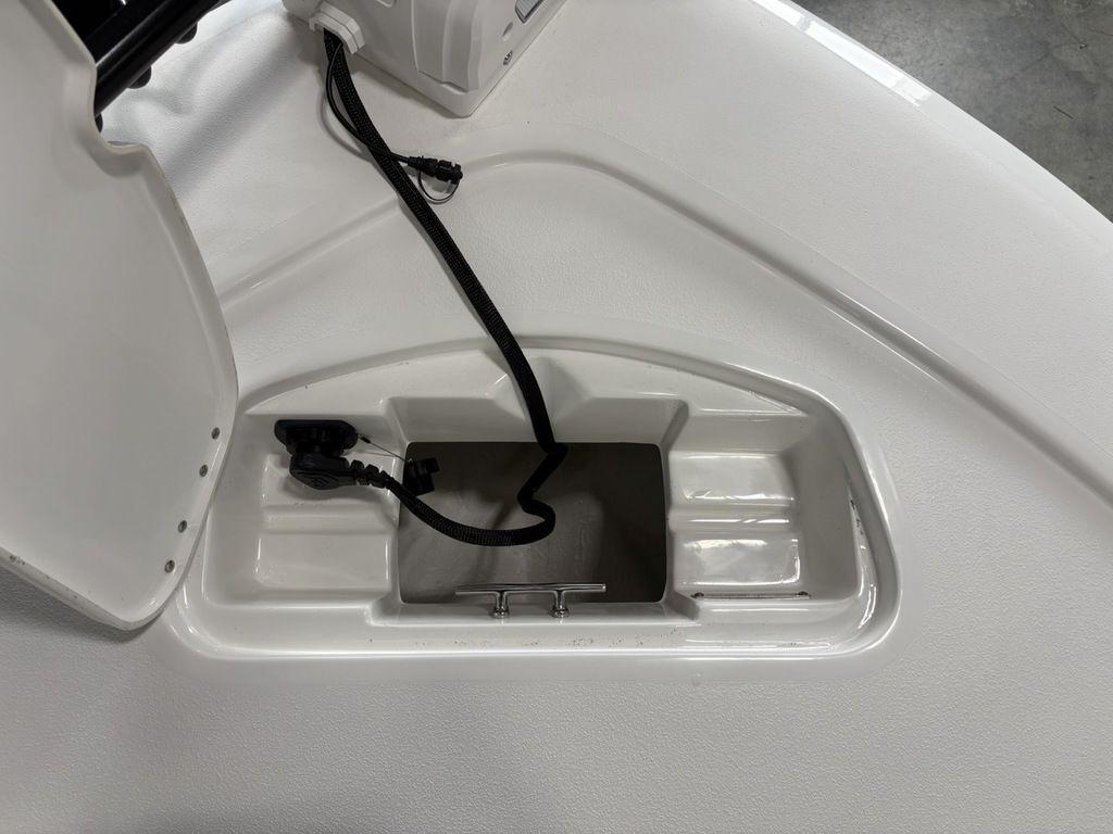 2026 Tidewater 2110 BM boat compartment with wiring and open hatch.