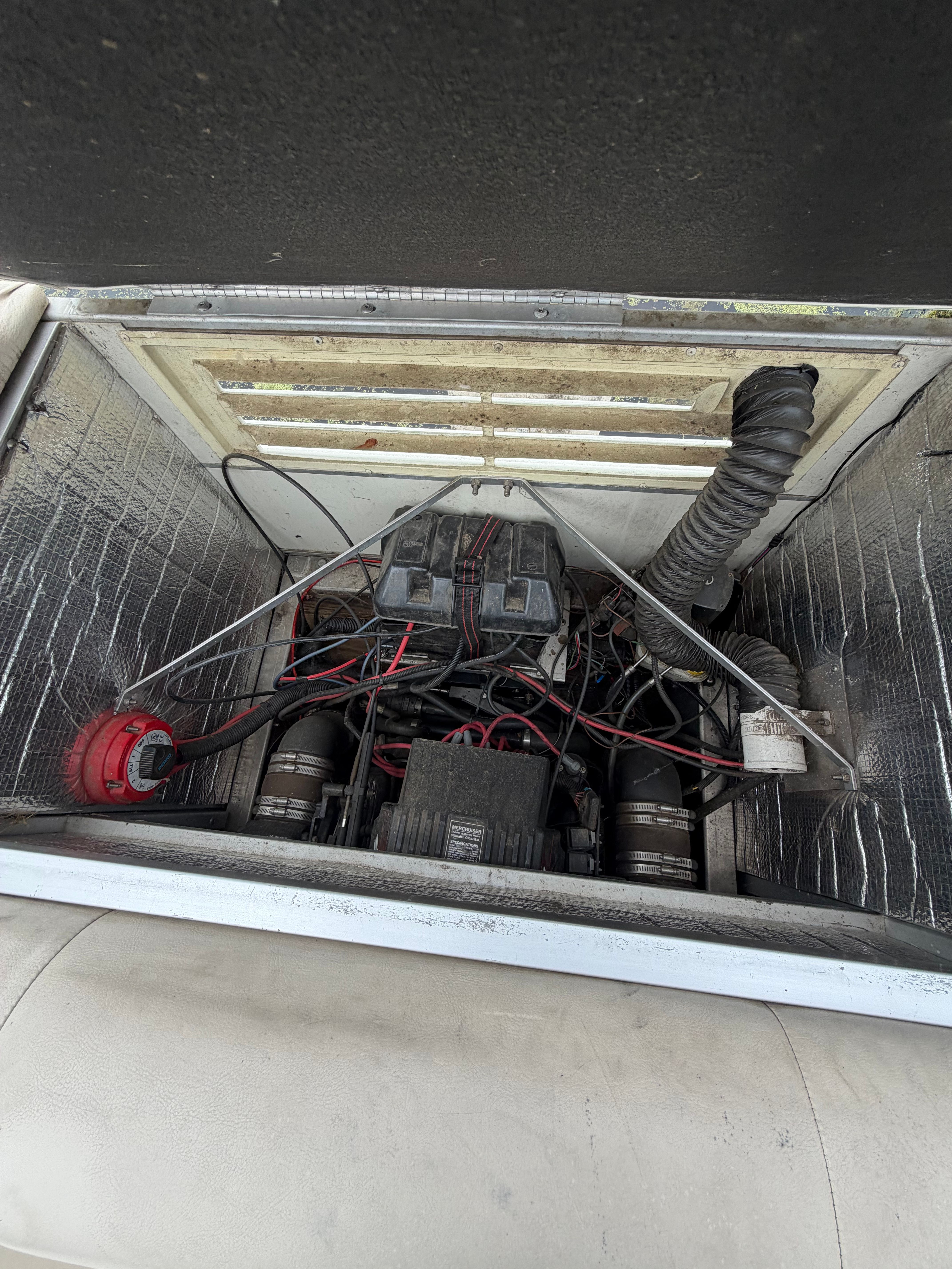 Engine compartment of a 2000 Crest Grand Caribbean with visible wires and components.