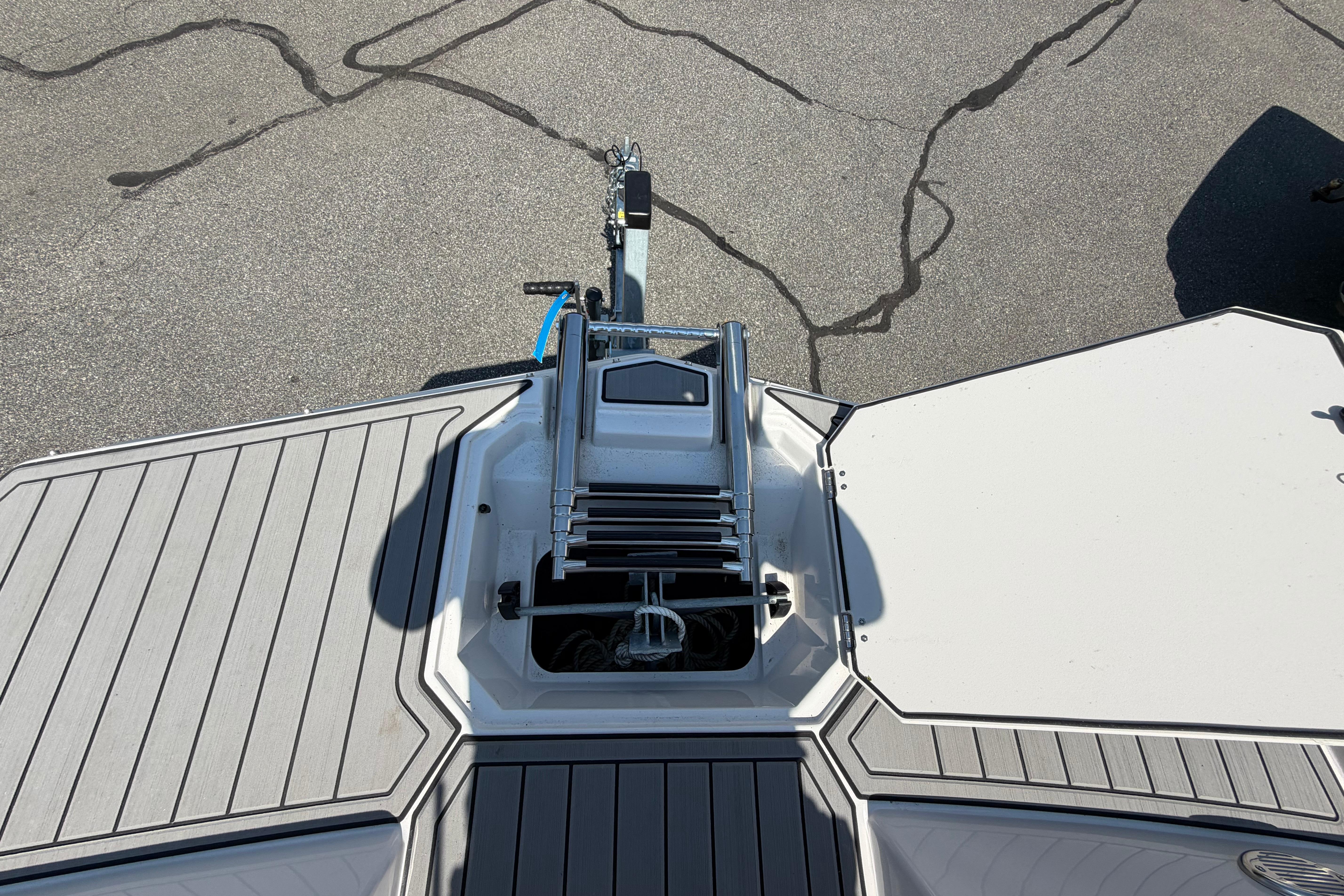 2025 Starcraft SVX 190 OB boat deck with ladder, viewed from above.