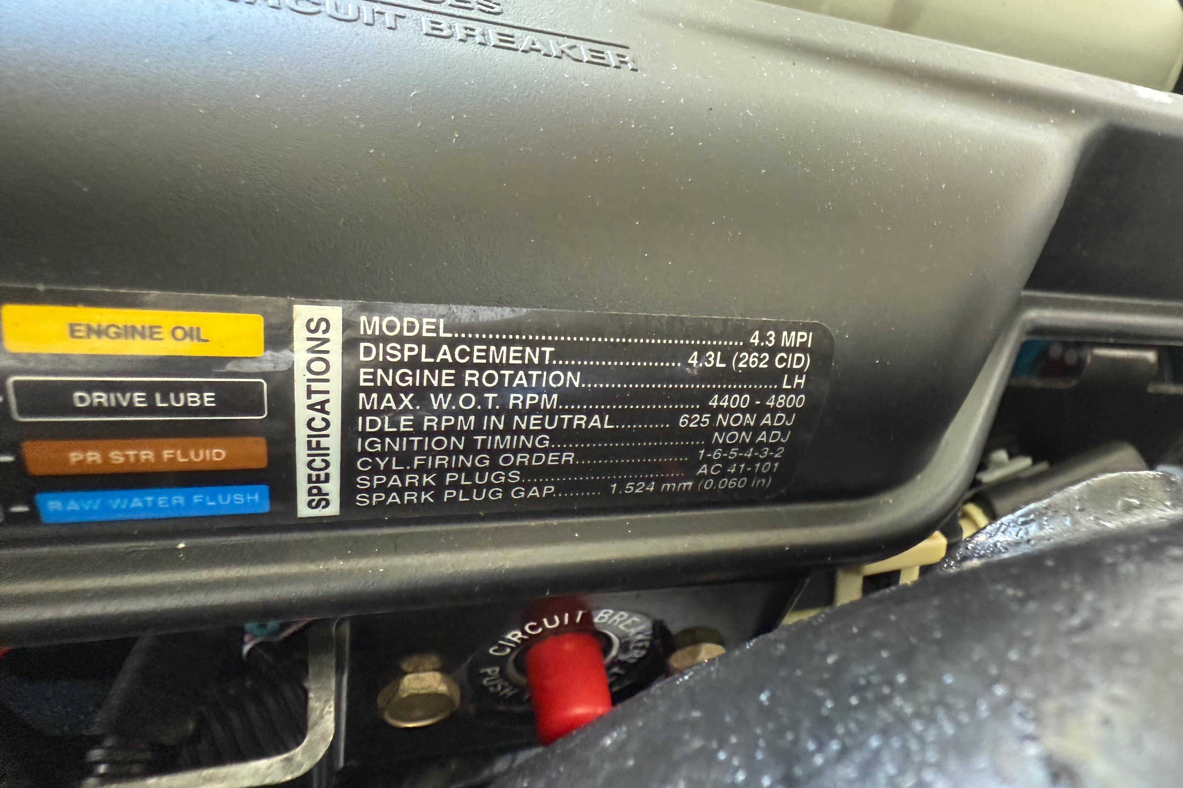 Engine specifications label on a 2015 Cobalt 200, detailing displacement and RPM.