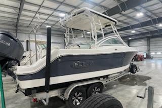 2022 Robalo R247 Dual Console boat in indoor storage facility.