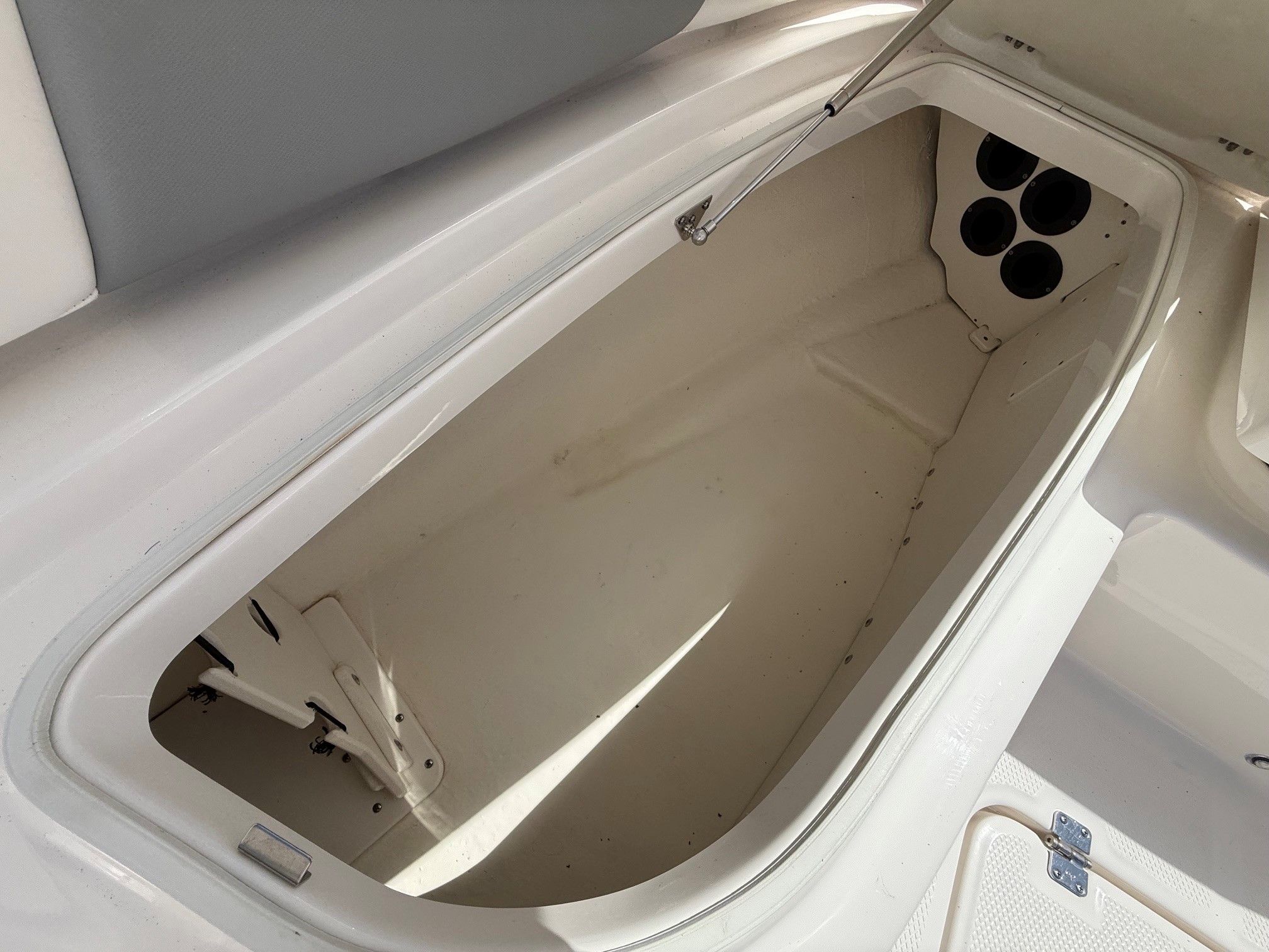 Storage compartment in 2021 Robalo 226 Cayman boat.