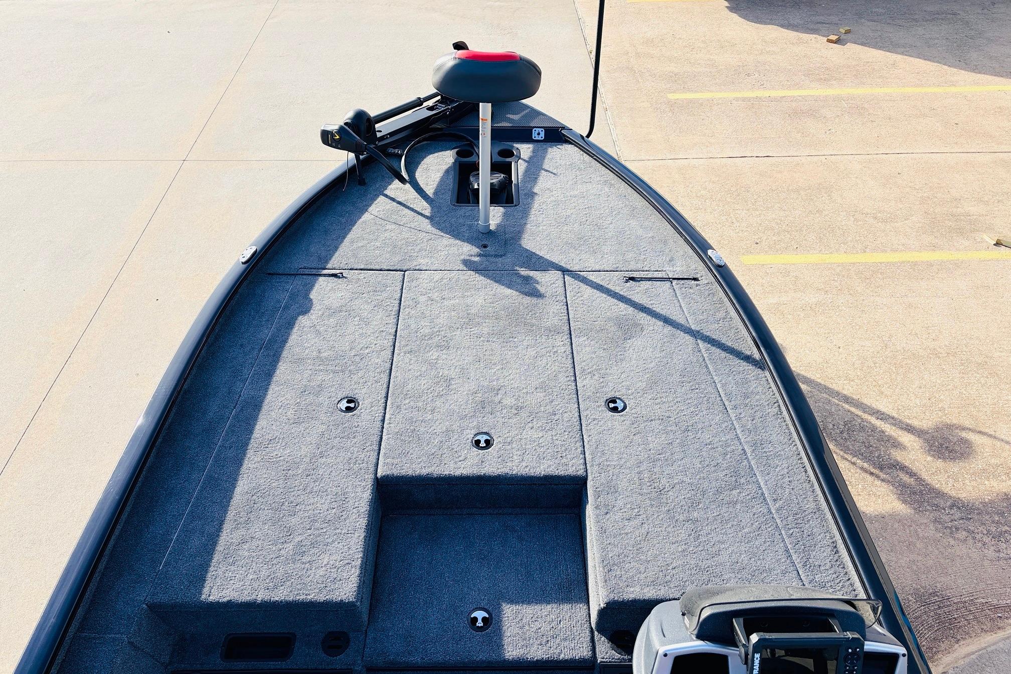 2025 Tracker Savage 215 boat deck with carpeted surface and seating.