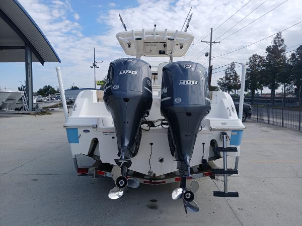 2015 Sea Fox 286 Commander boat with dual Yamaha 300 engines, parked outdoors.