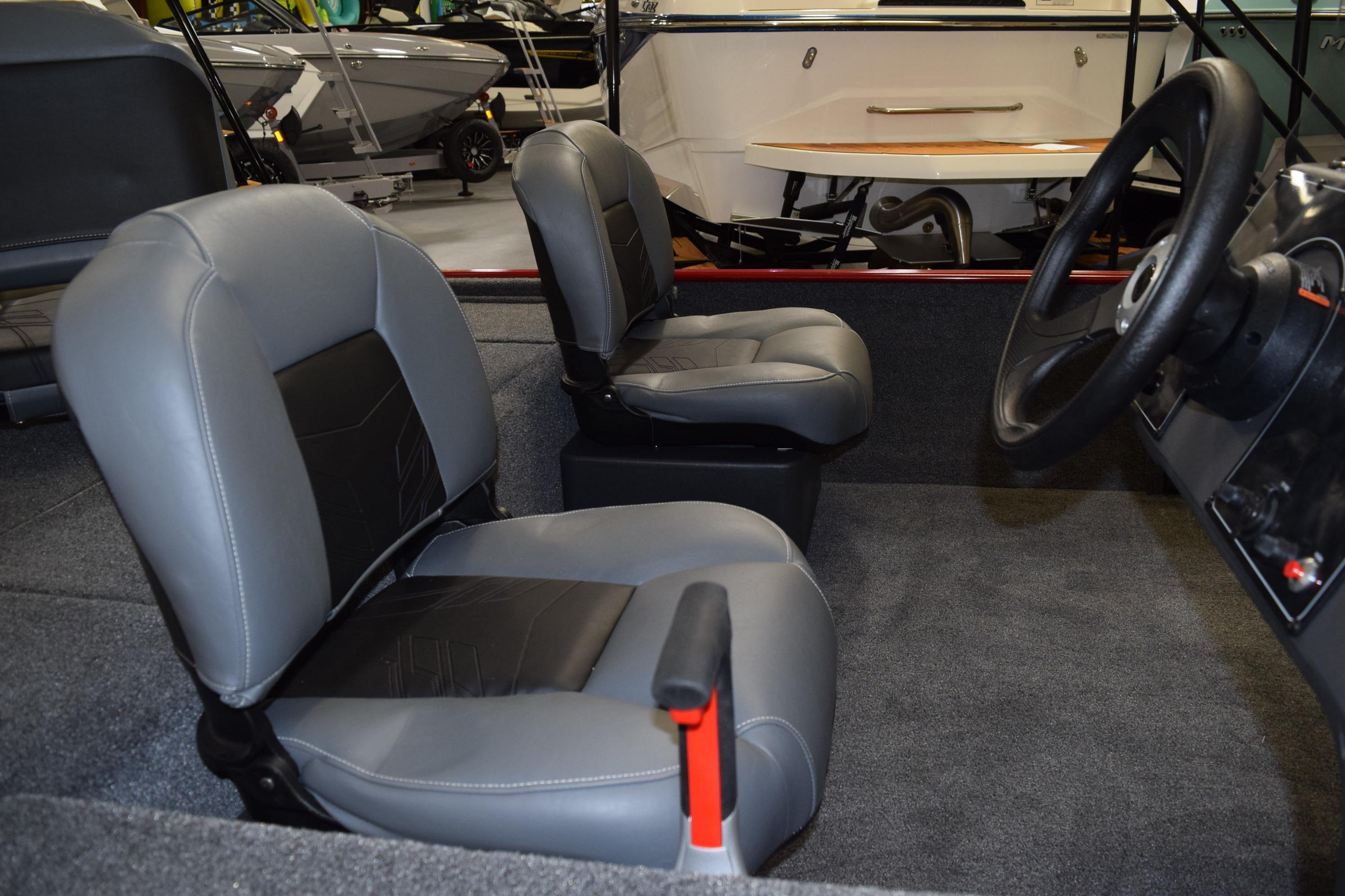 2026 Tracker Bass Tracker Classic XL boat interior with gray seating and steering wheel.
