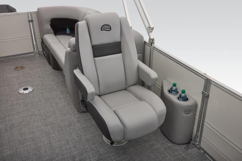 2026 Sun Tracker Party Barge 22 DLX interior with plush seating and cup holders.
