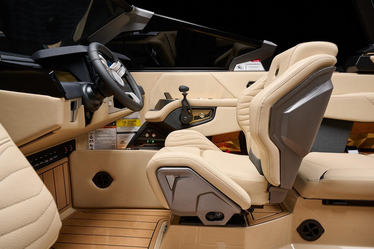 Manufacturer Provided Image: 2026 Nautique Super Air Nautique G23 interior with beige leather seats and modern dashboard.
