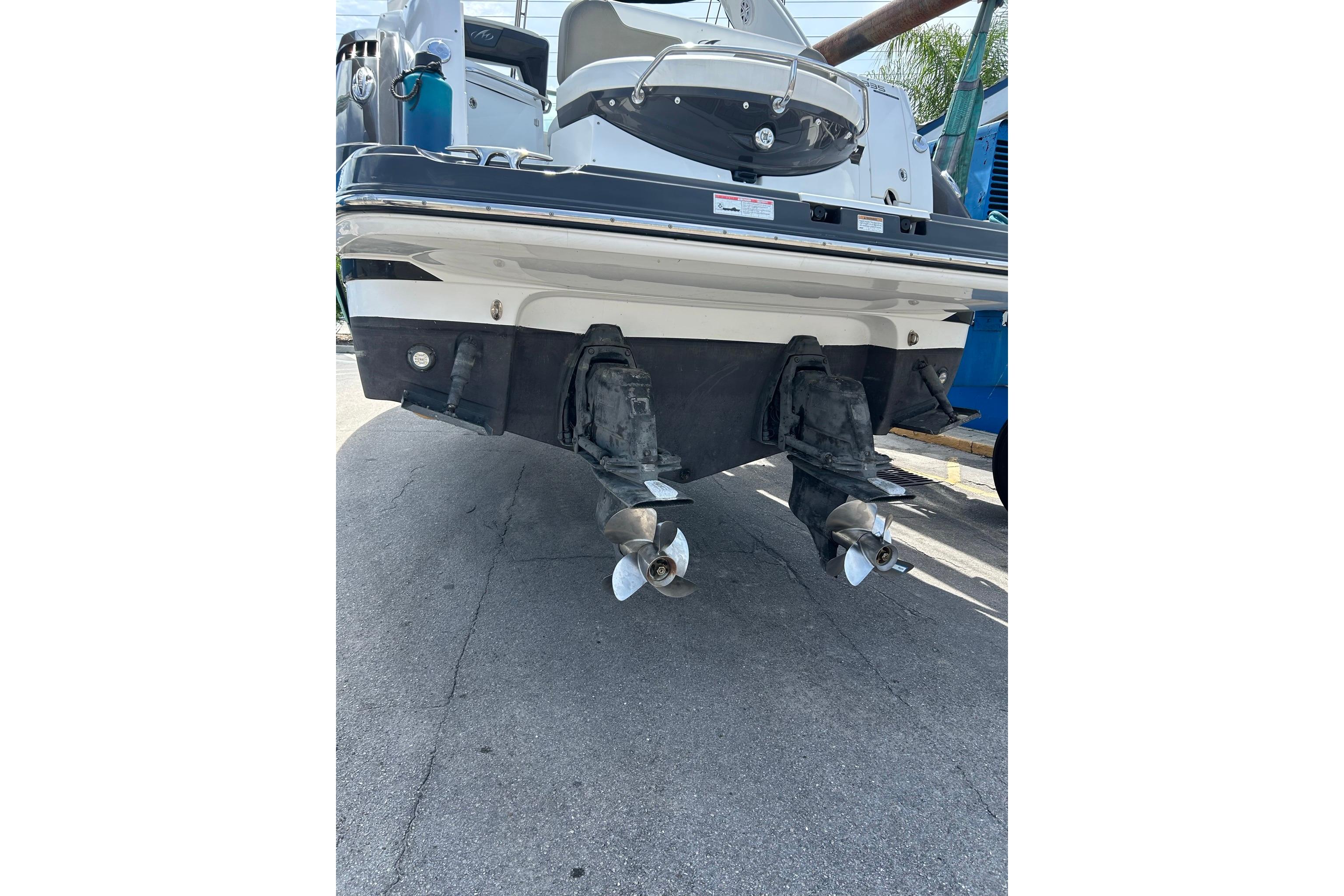 2019 Monterey 335 Sport Yacht rear view with dual propellers on display.