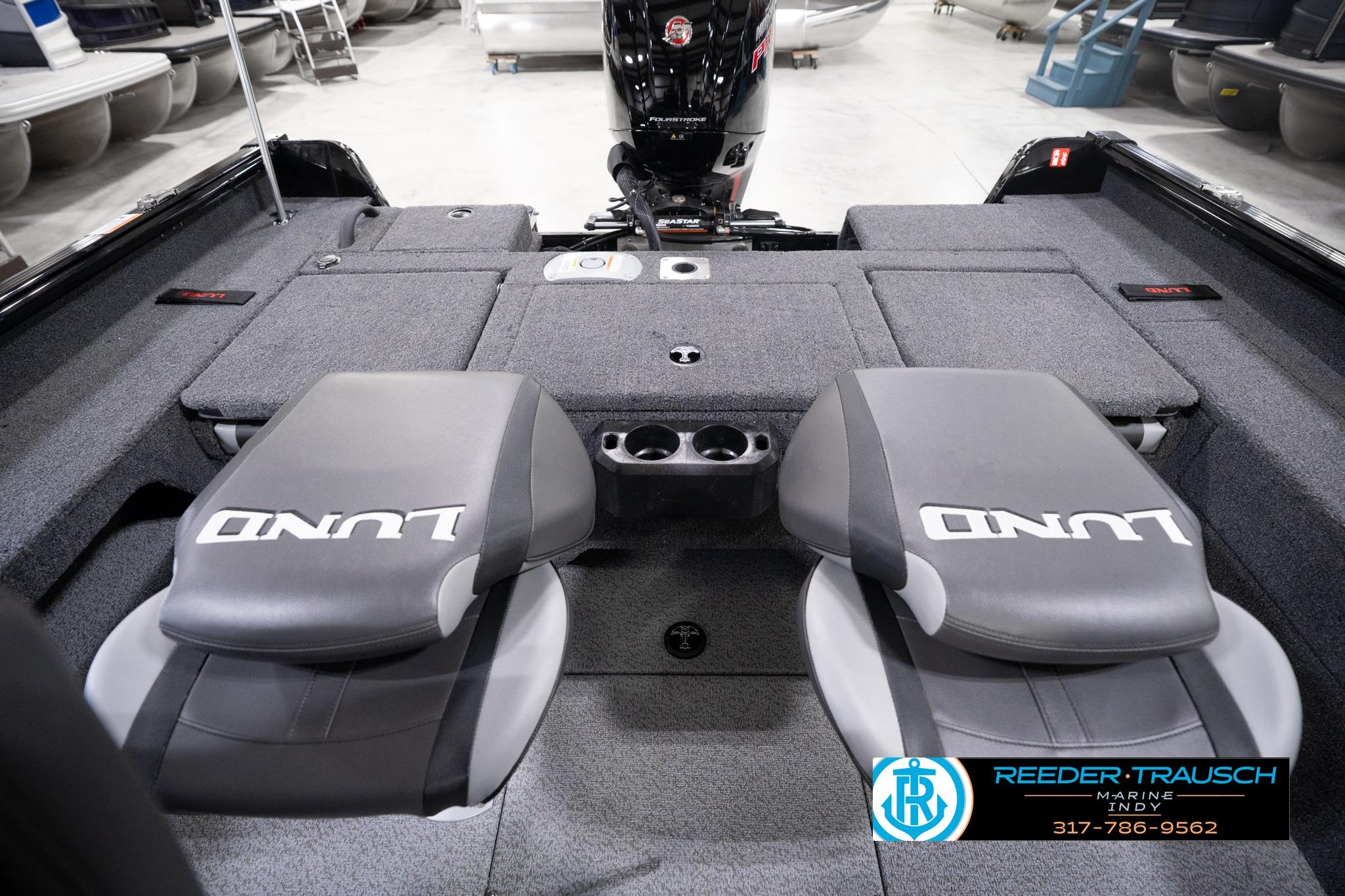 2026 Lund 1775 Impact XS SS boat interior with seating and storage compartments.