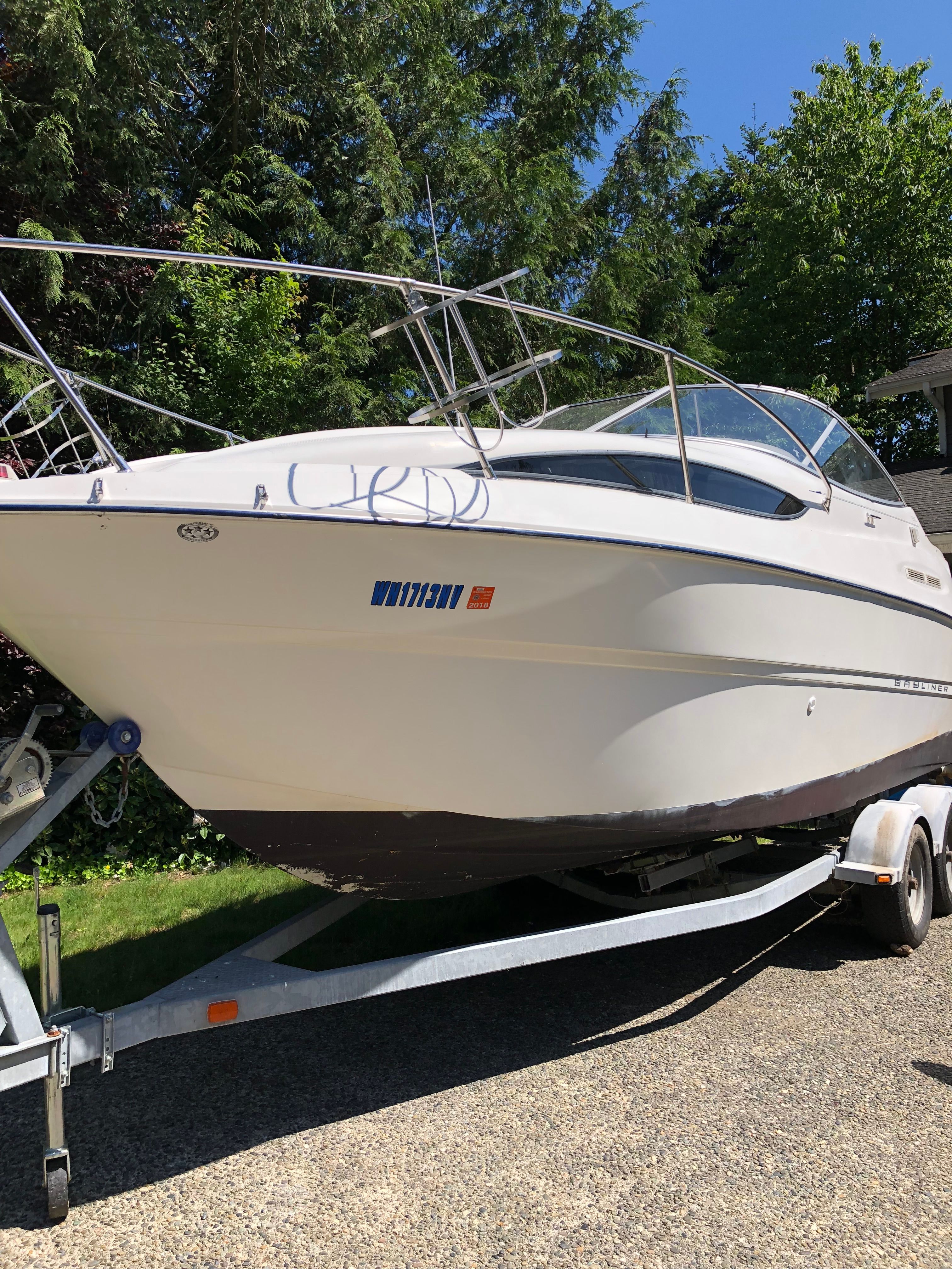 2005 Bayliner Cierra 245 on trailer outdoors.