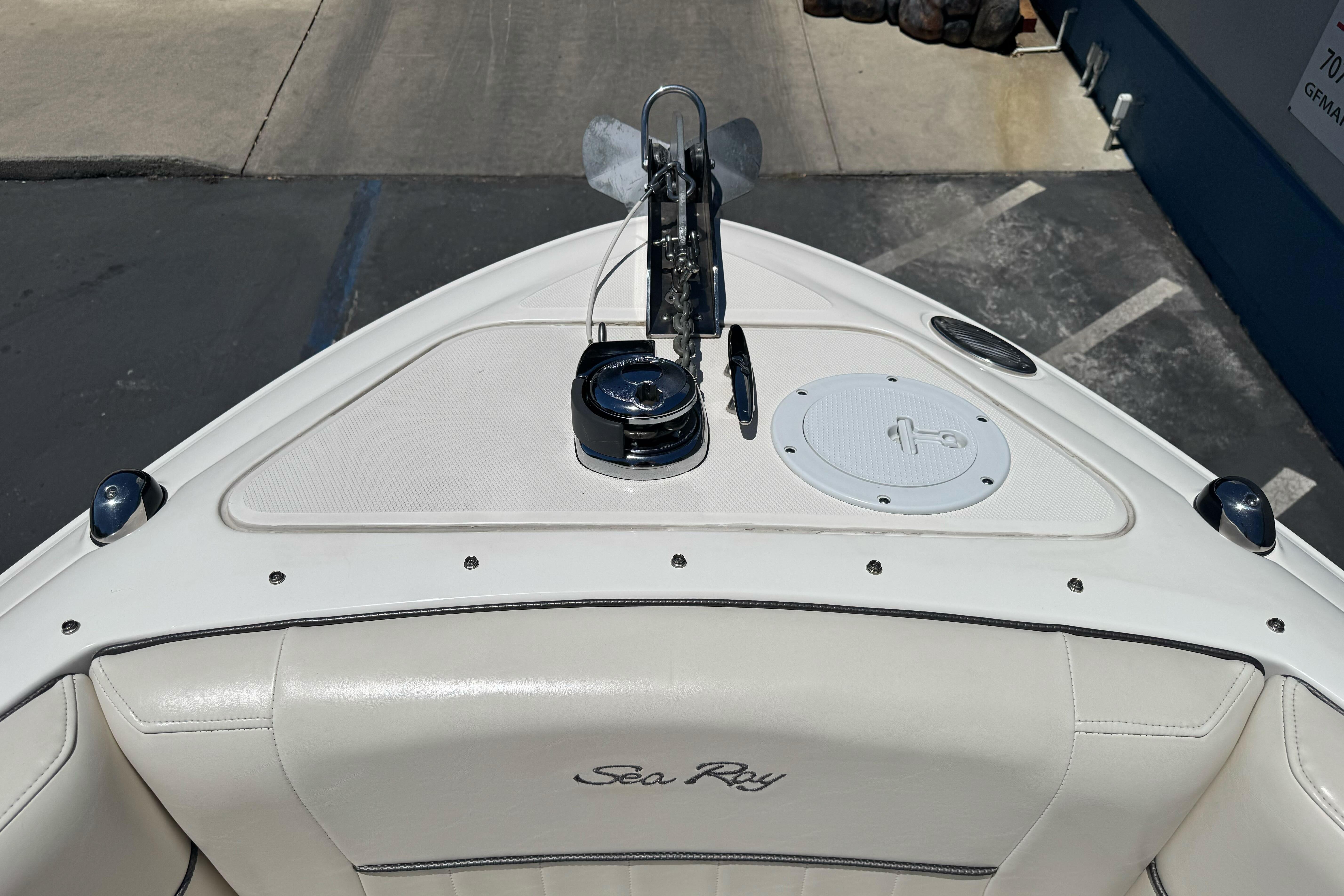 Bow of 2007 Sea Ray SLX 250 boat with anchor and seating area.
