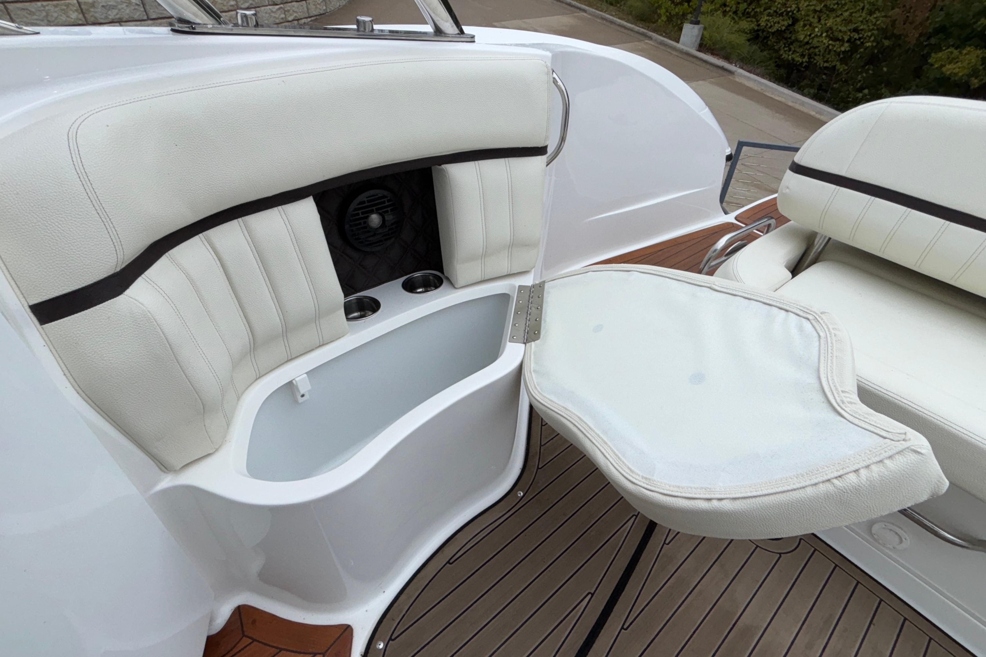 2022 Cobalt R35 boat interior with white seating and foldable table.