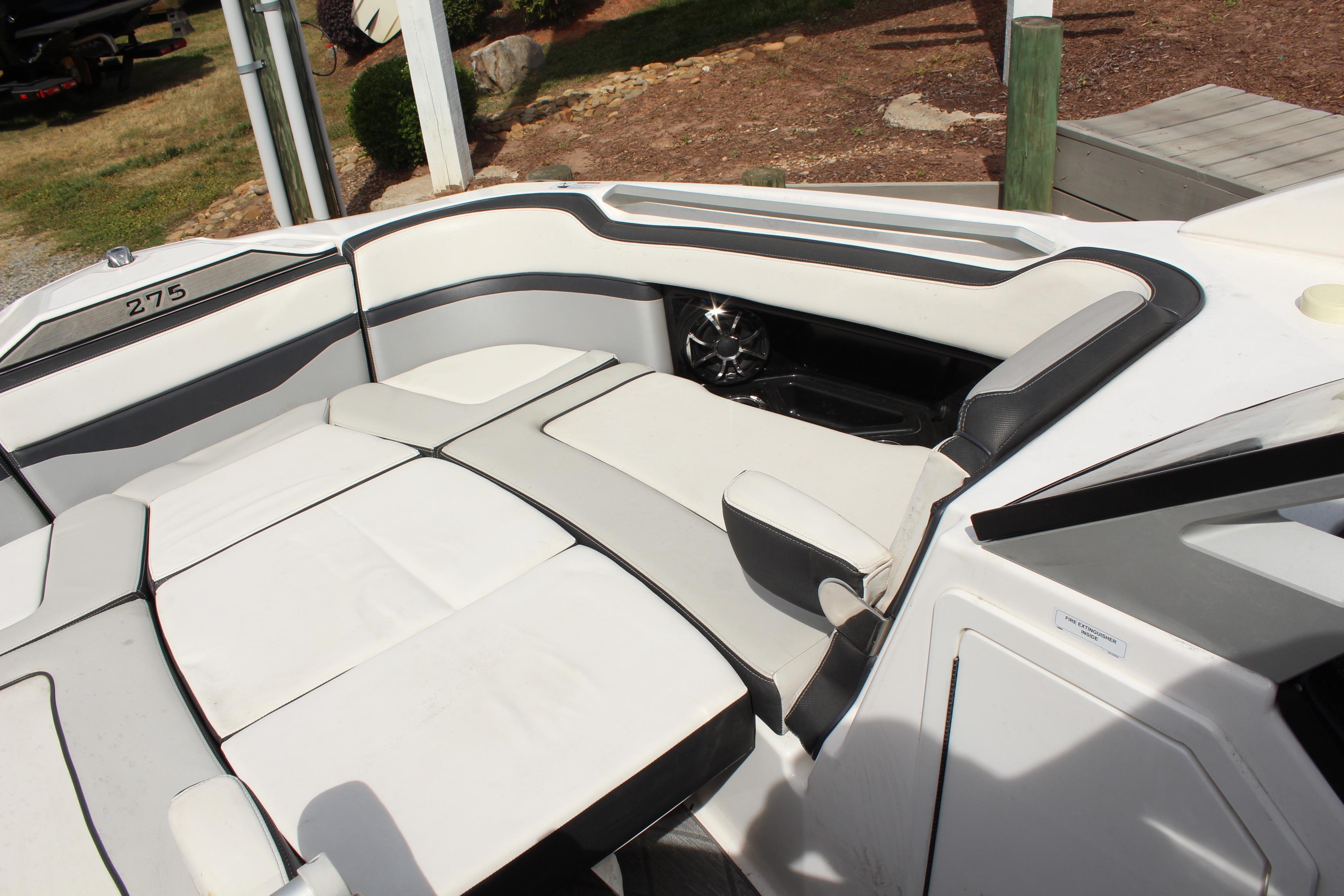 2020 Yamaha Boats 275SE interior with white and gray seating, showcasing luxury design.