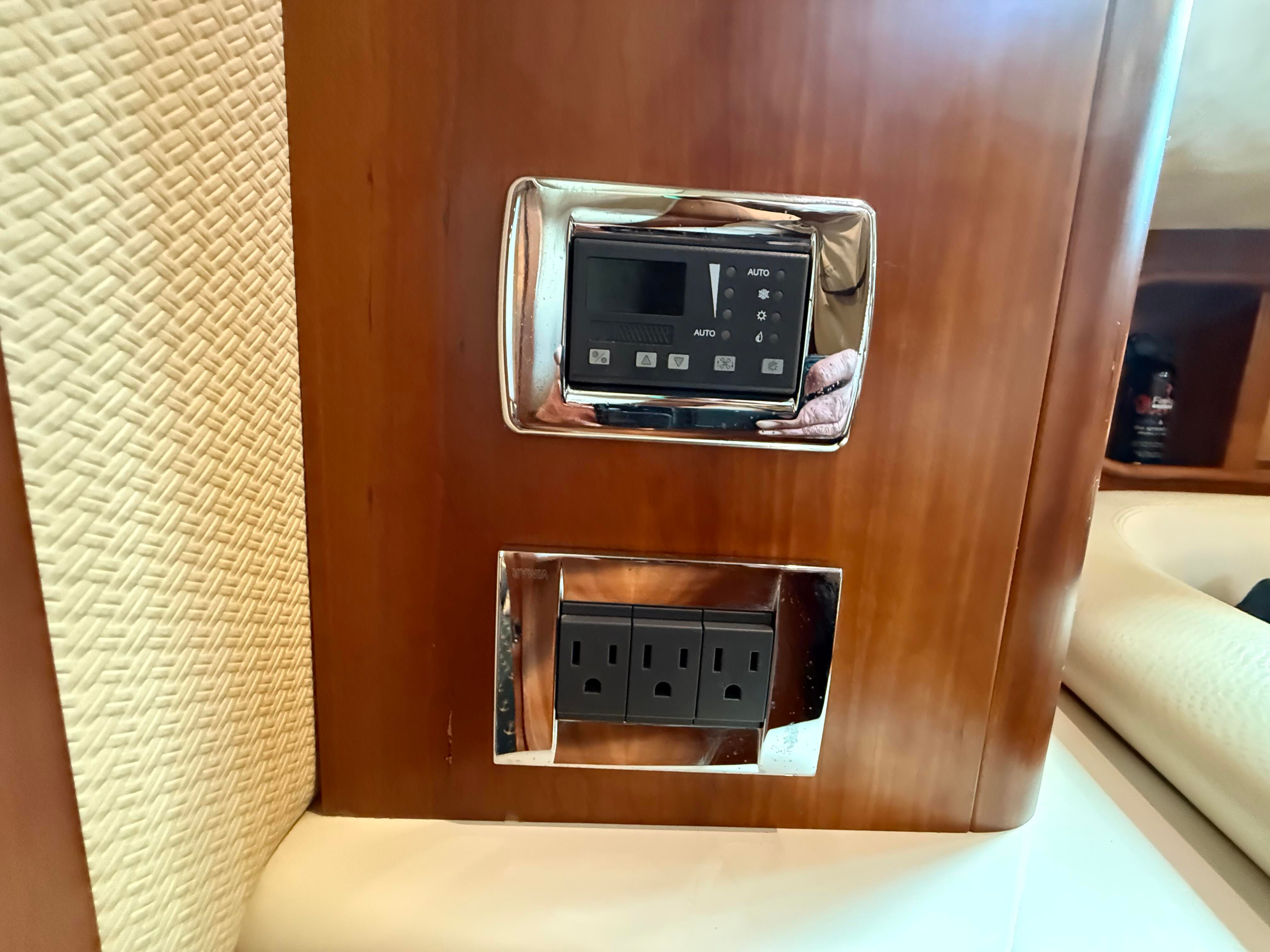 Interior view of a 2007 Chris-Craft Roamer 40 with outlets and control panel.