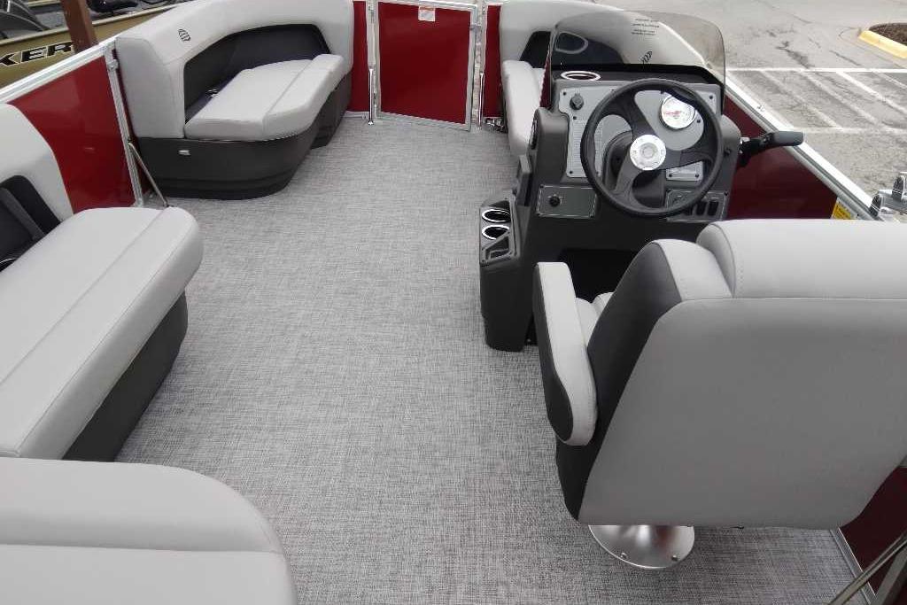 Interior of 2026 Sun Tracker Party Barge 16 DLX with seating and steering console.