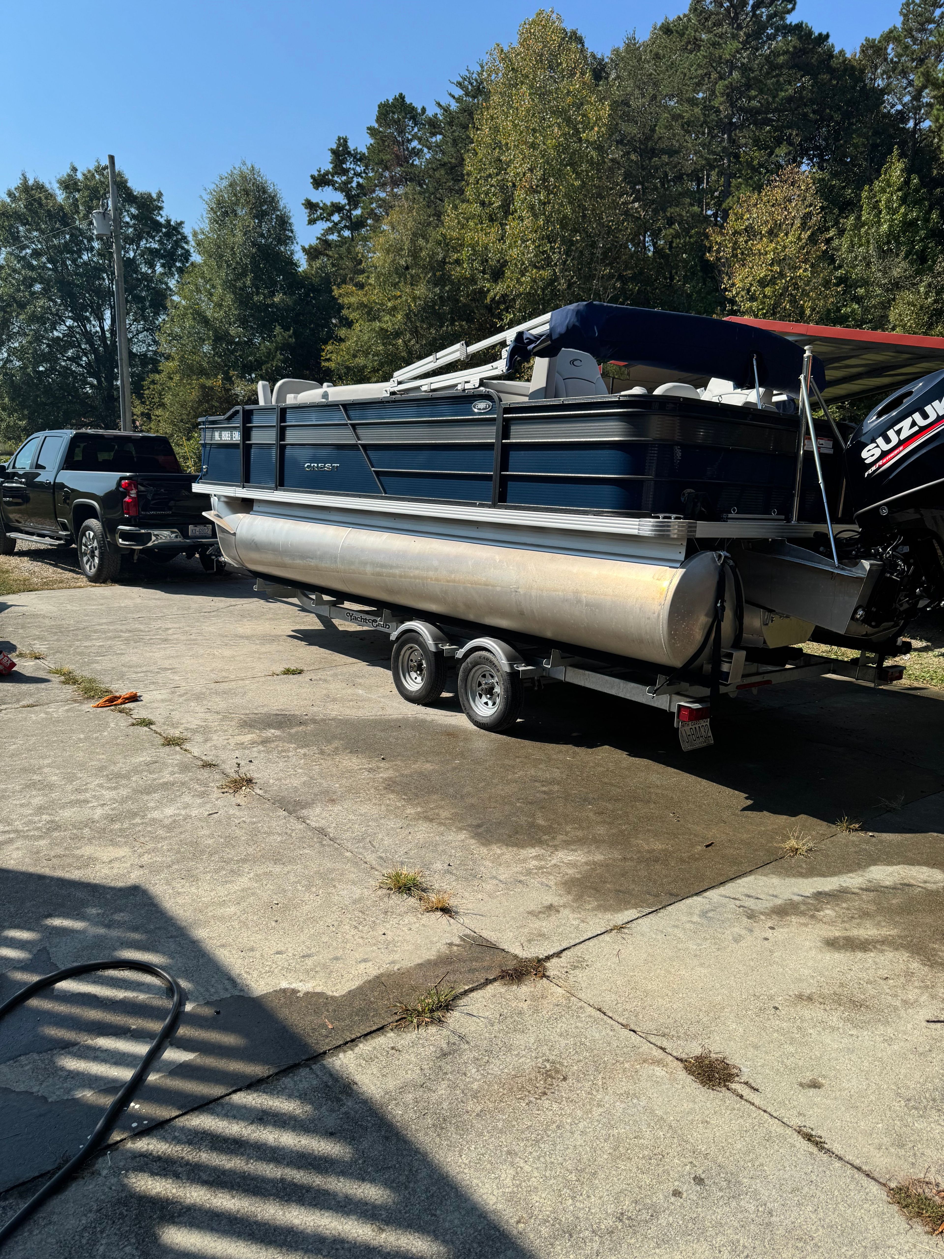 A 2019 Crest I Fish 200 C4 pontoon boat on a trailer, ready for transport.