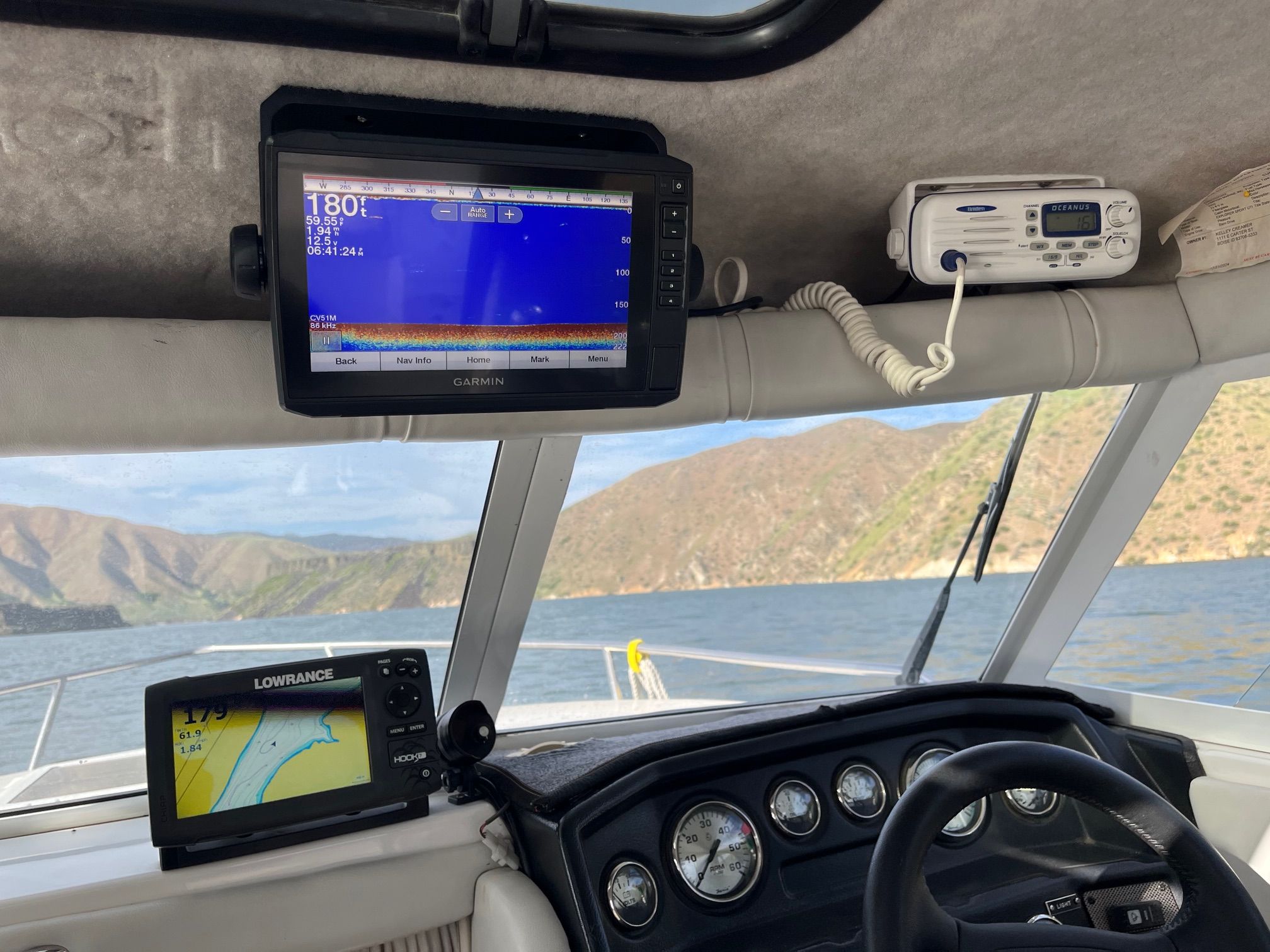 The image shows the cockpit of a 2002 Campion 622 Explorer boat with navigation equipment.