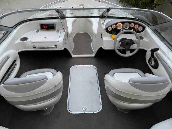 Interior of a 2006 Stingray 195LR bowrider with two swivel seats and a helm station.