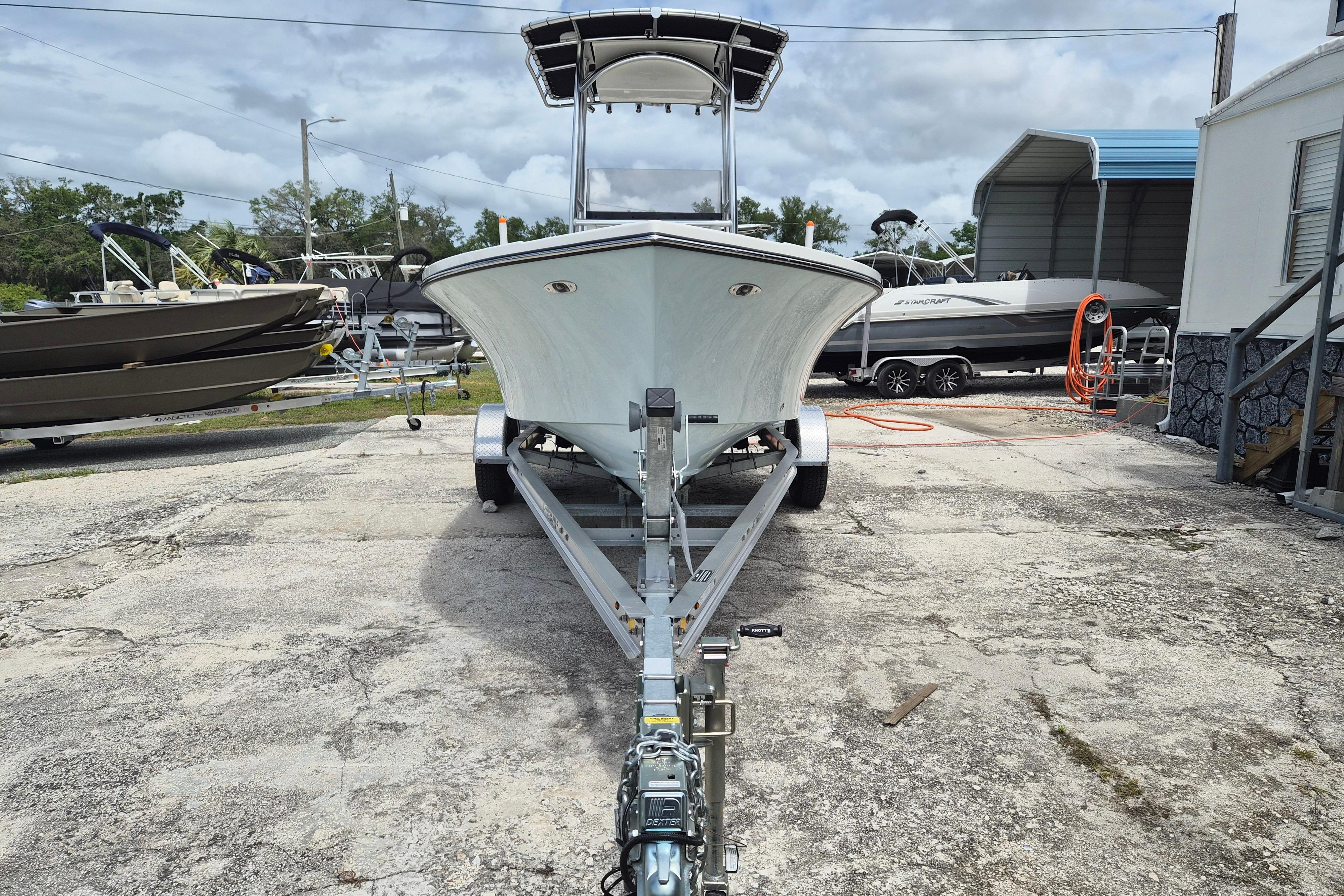 2026 Defiance Catalina 190 boat on trailer in outdoor storage area.
