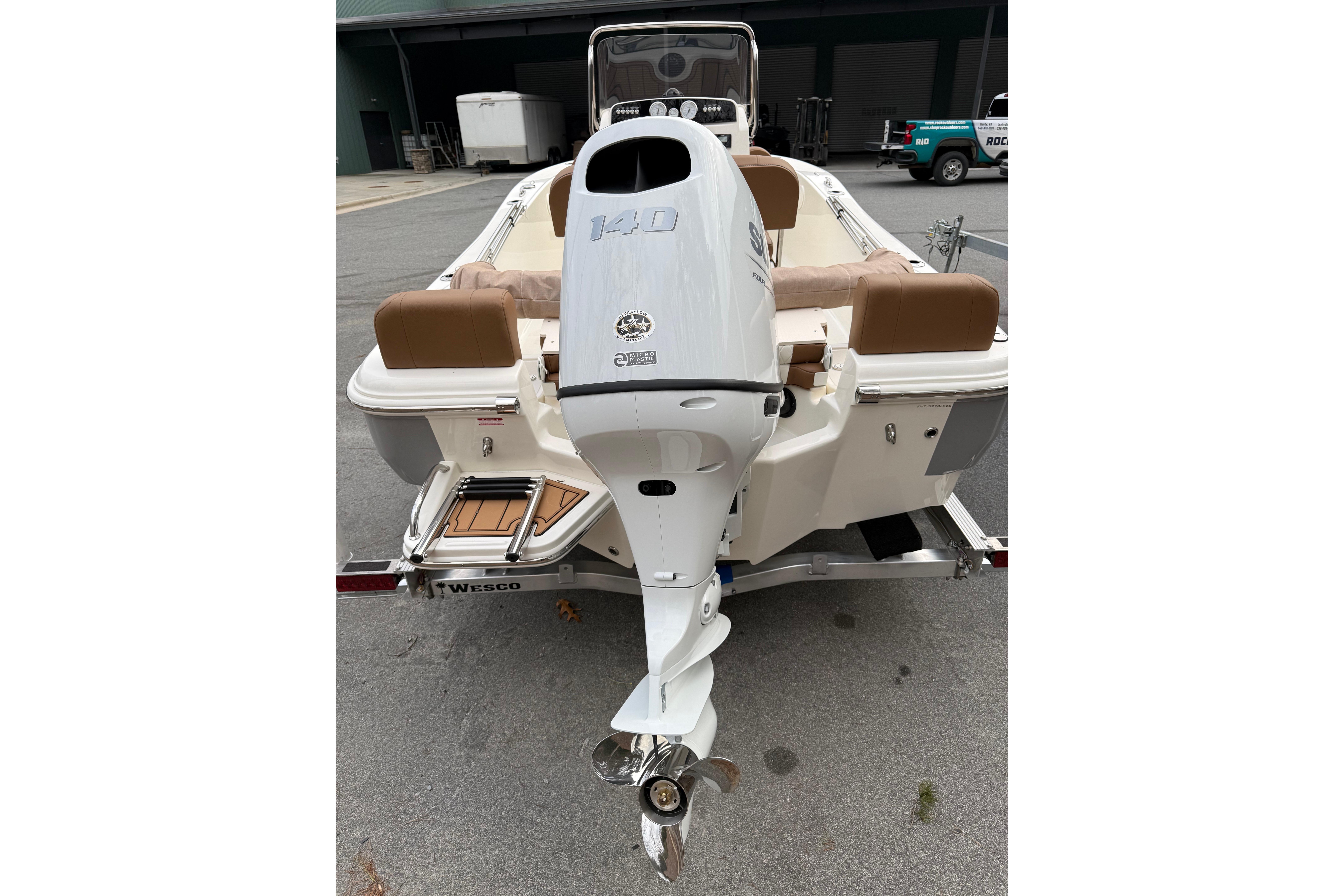2026 Pioneer 180 Islander boat with Suzuki outboard motor on trailer.