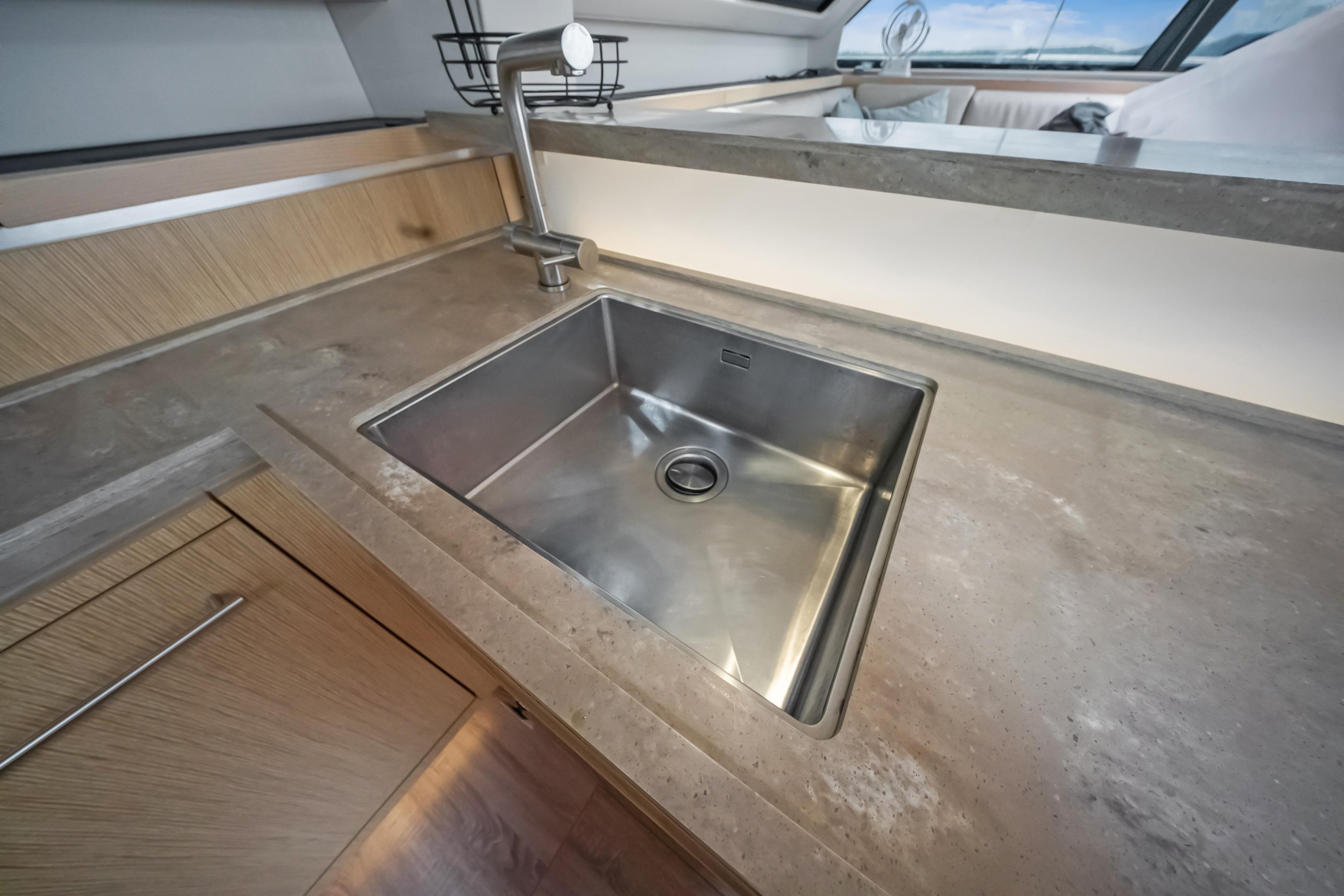 Modern kitchen sink in 2023 Privilege 510 yacht, featuring sleek design and stainless steel finish.