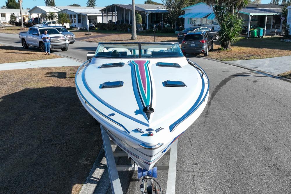 1989 Formula 292 SR-1 boat on trailer in residential neighborhood.