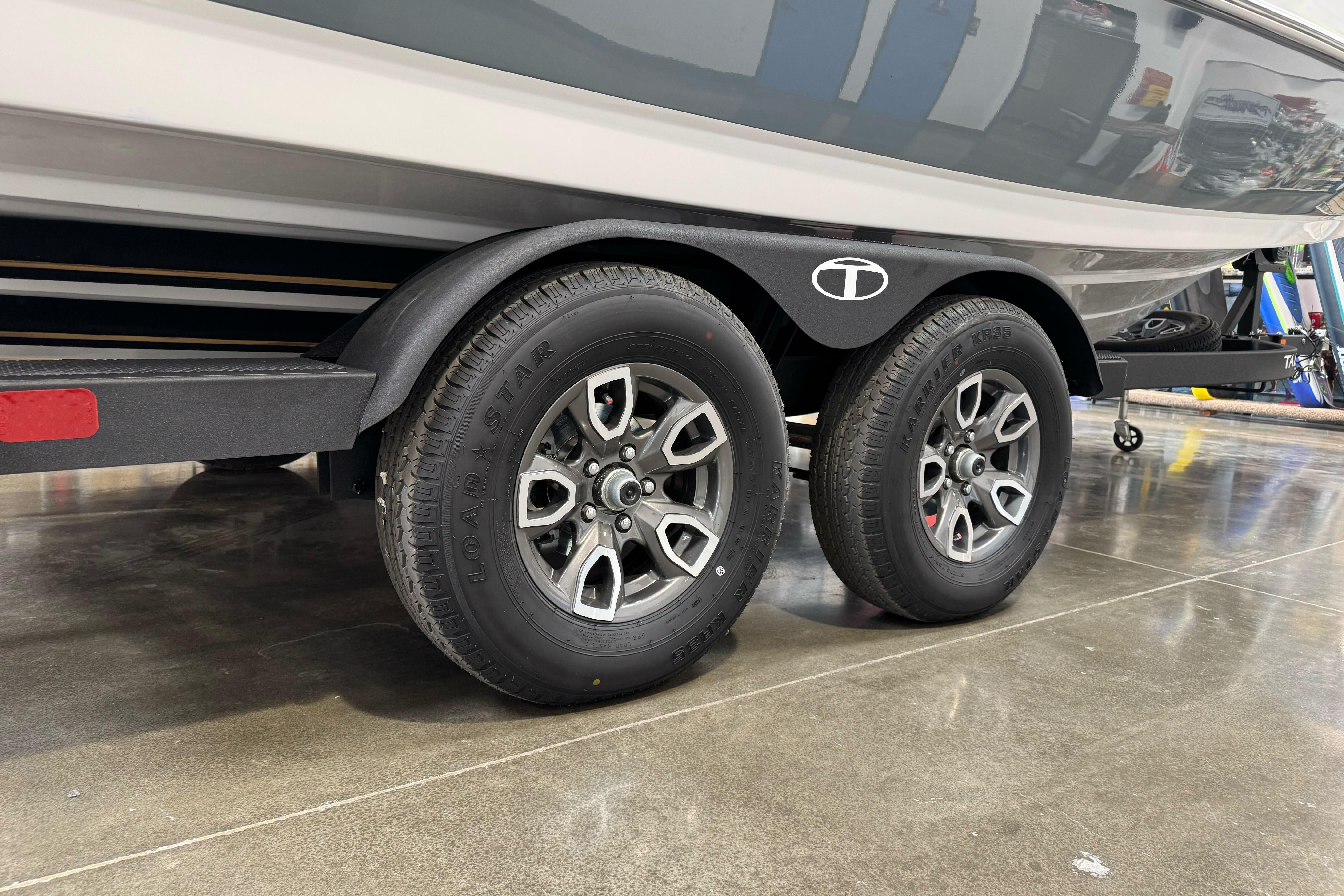 2026 Tahoe 2150 boat trailer with dual wheels on polished concrete floor.
