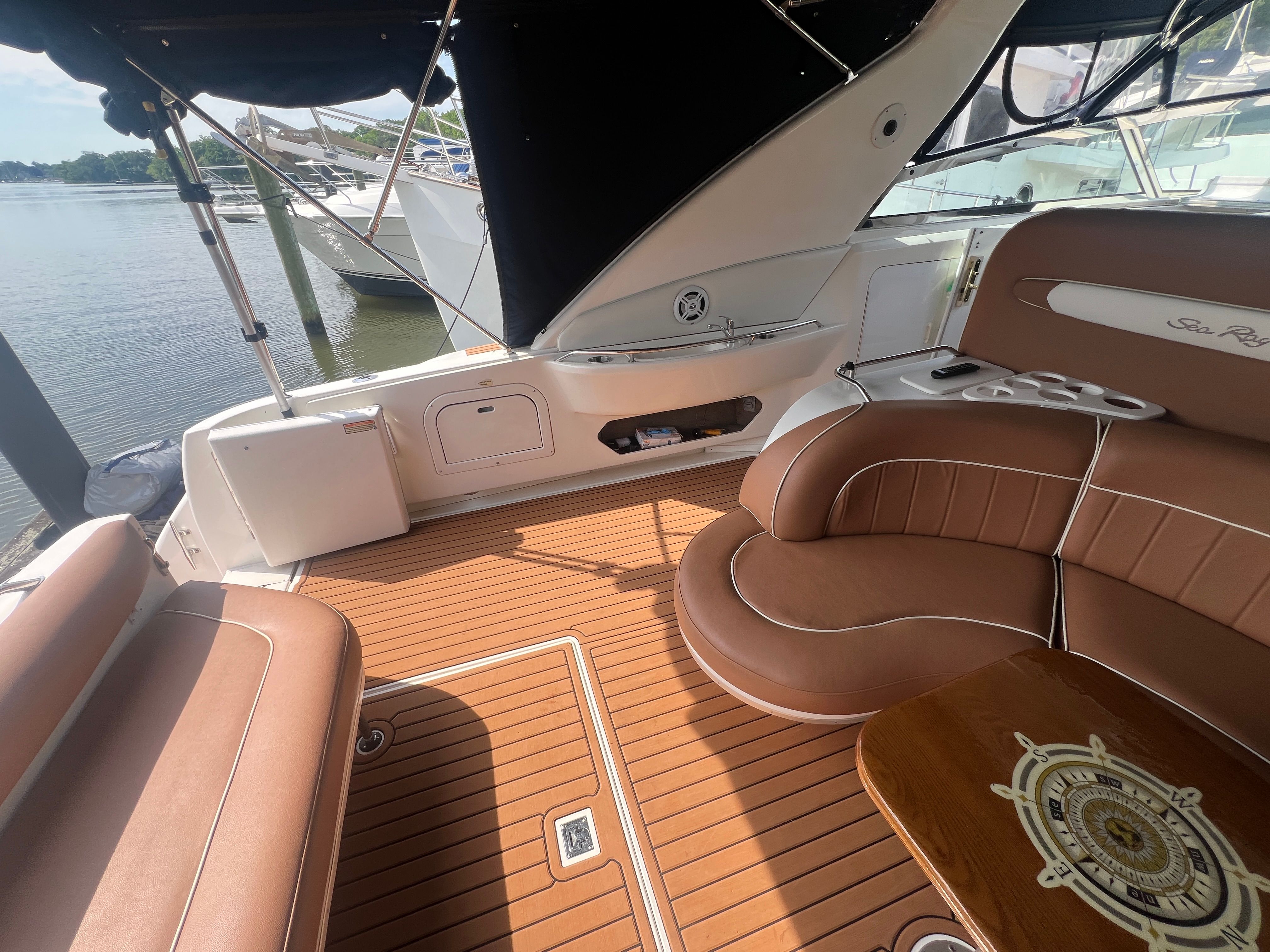 Interior of a 1997 Sea Ray 450 yacht with brown leather seating.