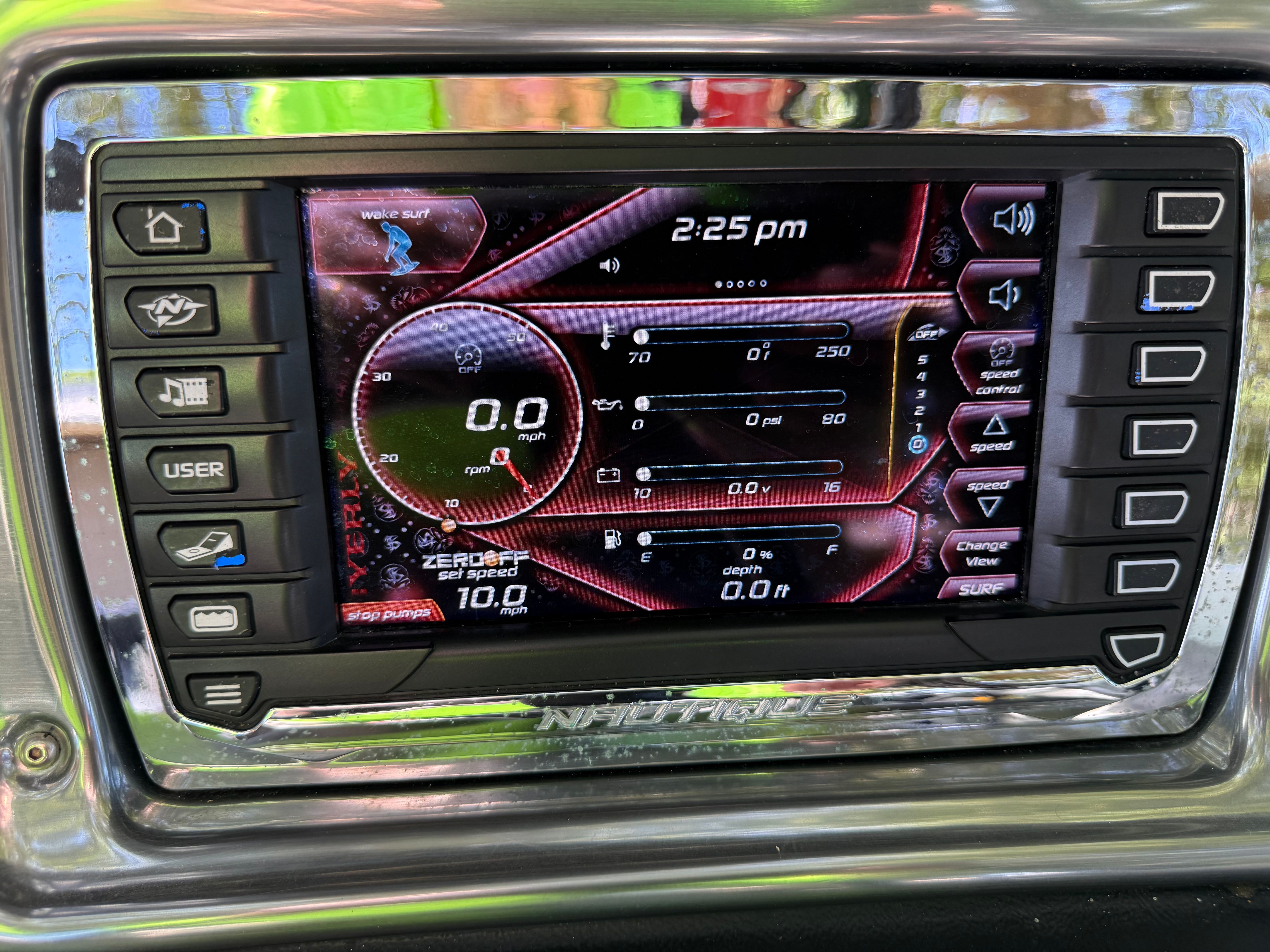 2012 Nautique Super Air Nautique 210 dashboard with touchscreen display.