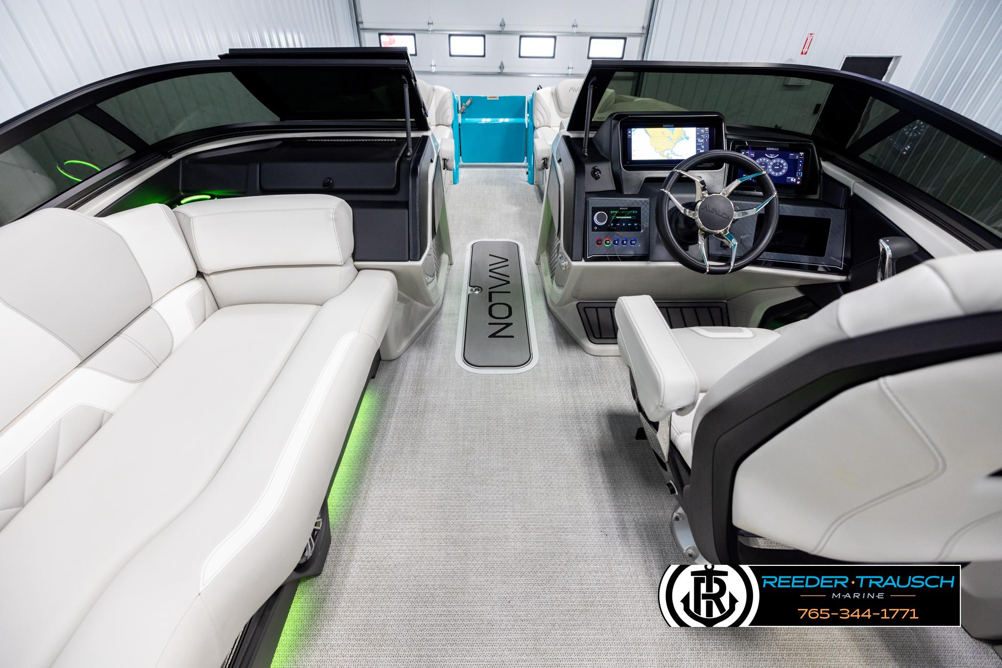 Interior of 2025 Avalon 2585 Excal VRBW boat with modern dashboard and seating.