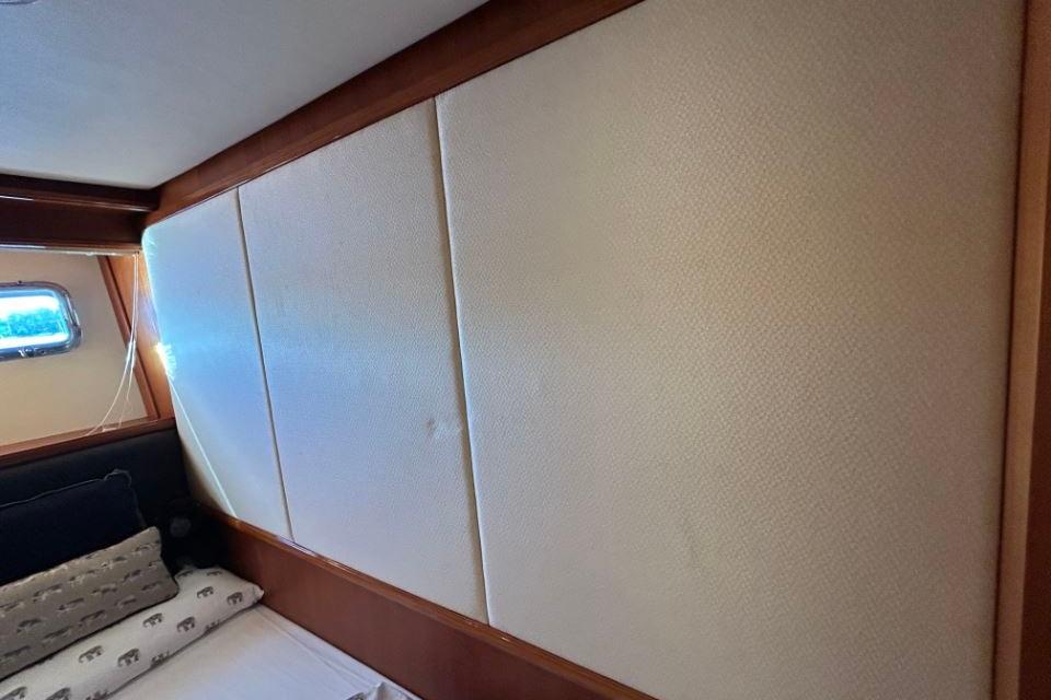 Interior cabin of 2008 Grand Banks 59 Aleutian RP yacht with padded walls.