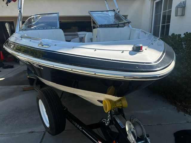 A 2006 Four Winns 190 Horizon boat on a trailer, ready for use.