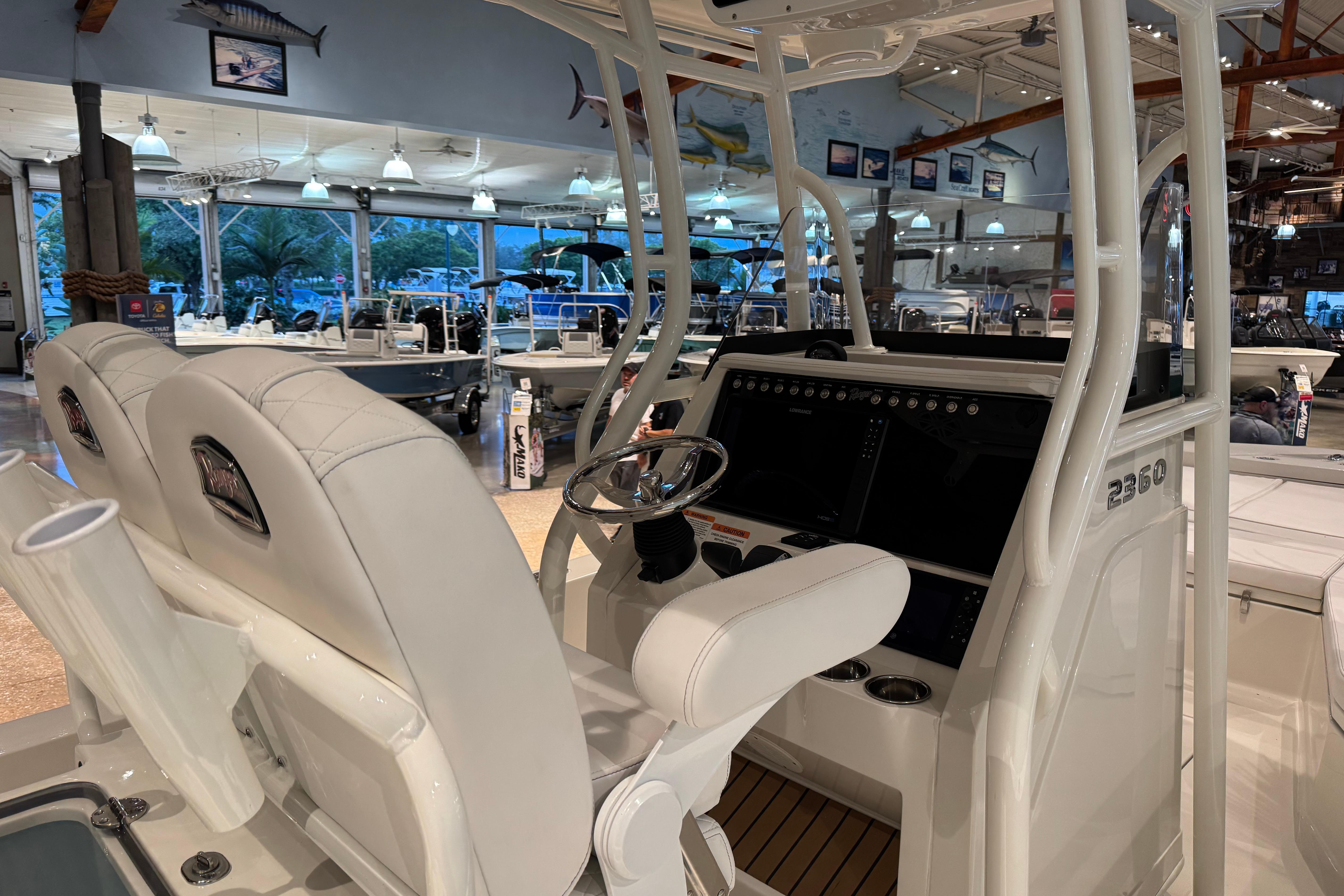 2025 Ranger 2360 Bay boat interior with modern helm and seating in showroom.