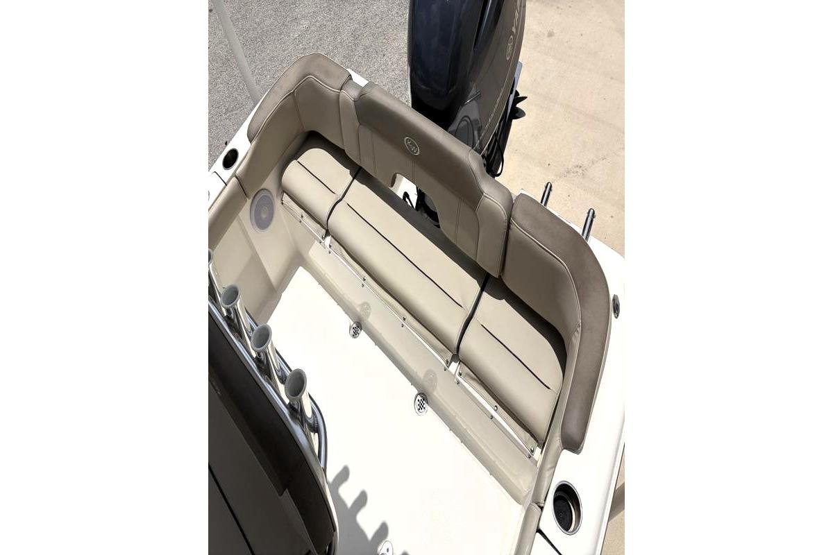 2023 Key West 203 FS boat interior with cushioned seating and rod holders.