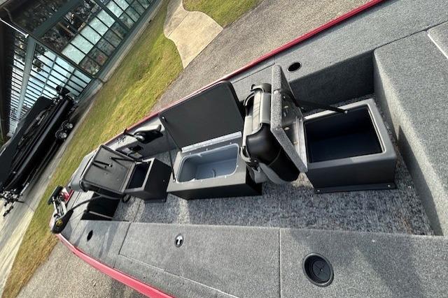 2025 Tracker Panfish 17 boat interior with open storage compartments and seating.