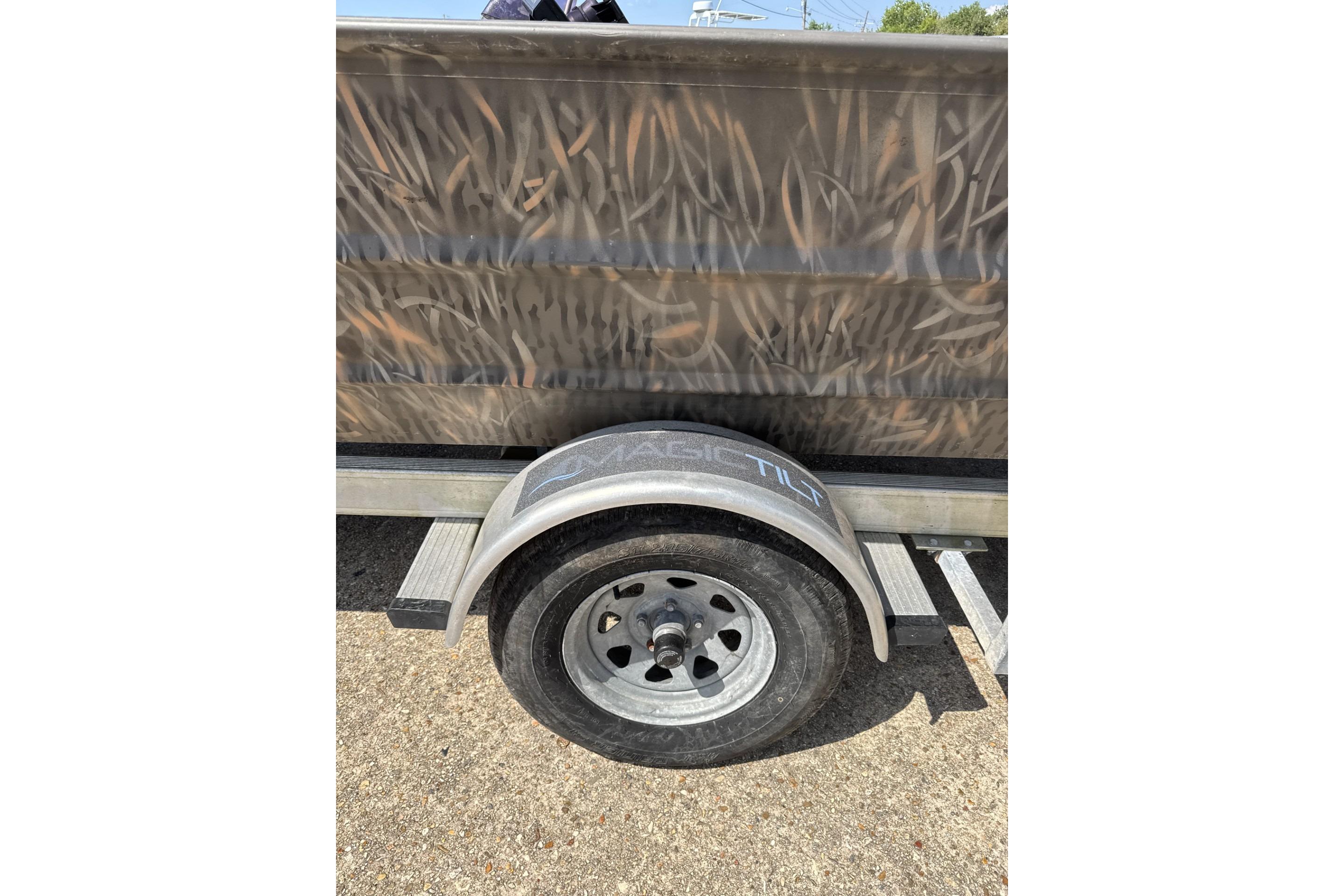 2022 Alweld 2270 Large Flat Bottom boat trailer with camo design and visible wheel.