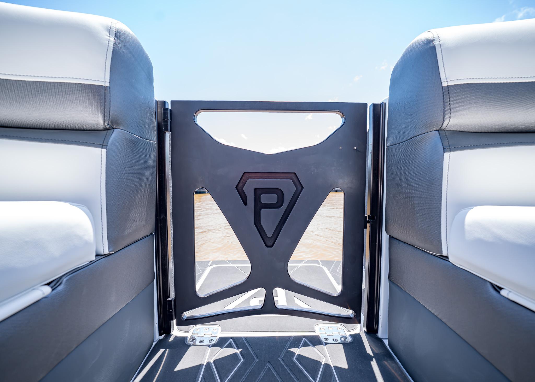 2025 Paradigm Damascus 266 Surf boat interior with stylish seating and logo.
