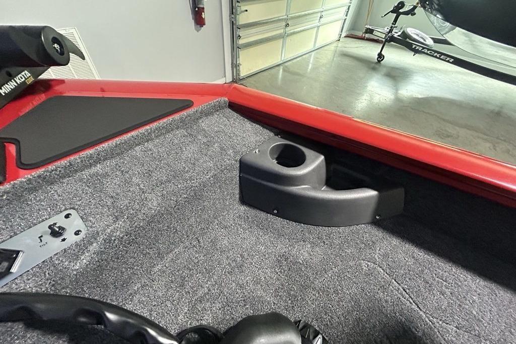 Interior of 2026 Tracker Pro Team 175 Crappie Edition boat with carpeted flooring.