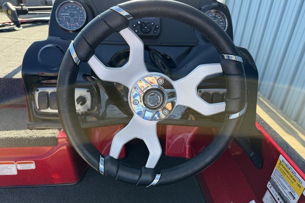 Steering wheel of a 2026 Nitro Z17 boat, featuring a modern design and dashboard controls.