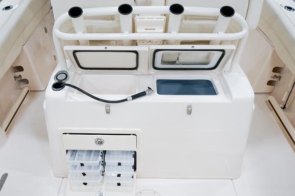 Manufacturer Provided Image: 2024 Grady-White Canyon 271 fishing station with rod holders and storage compartments.