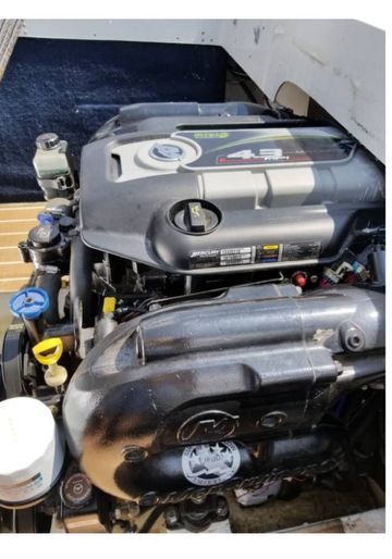 Engine compartment of a 1969 John Allmand Citation II with a modern engine.