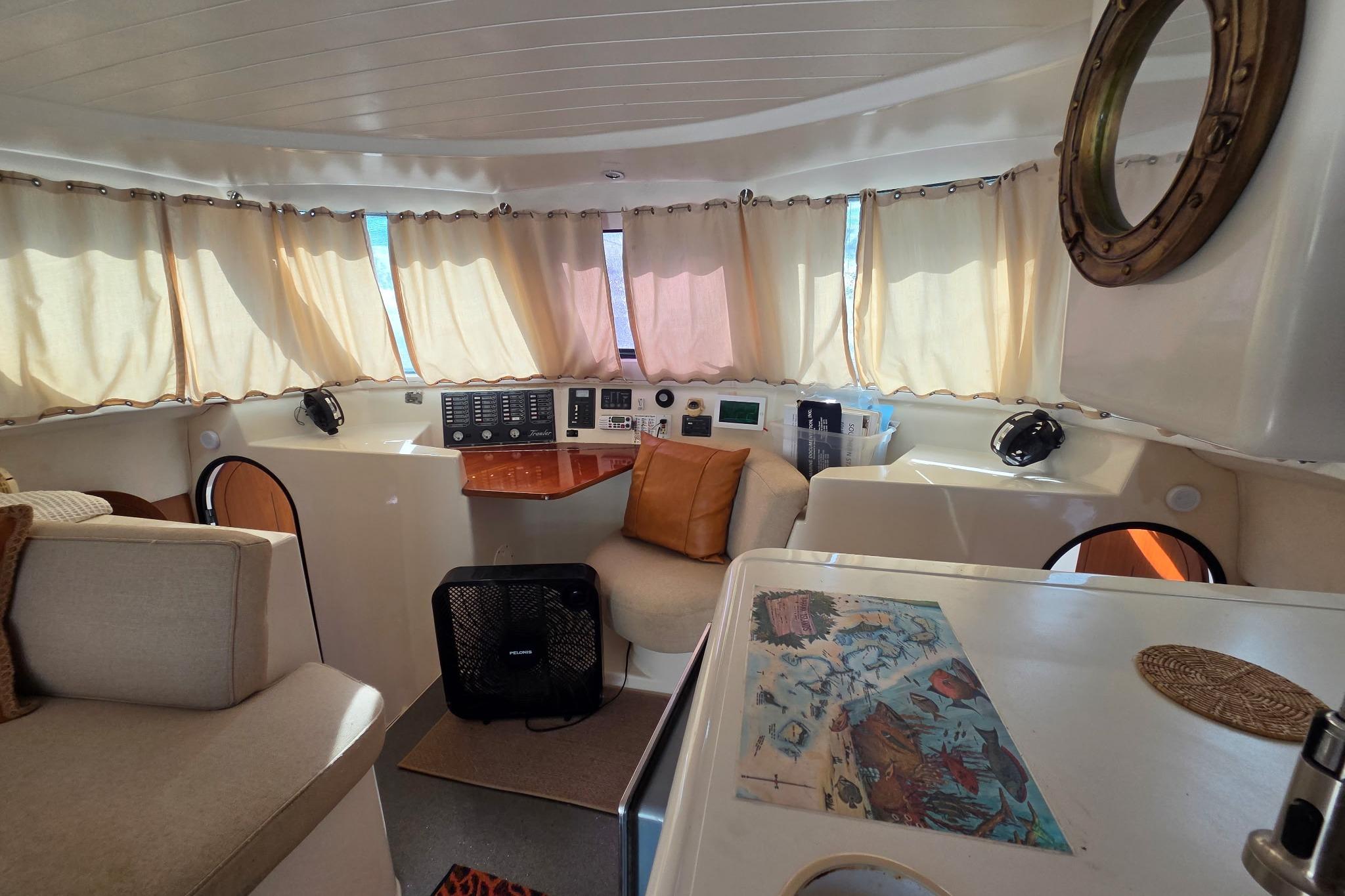 Interior of 2000 Fountaine Pajot Maryland 37 yacht with cozy seating and navigation area.