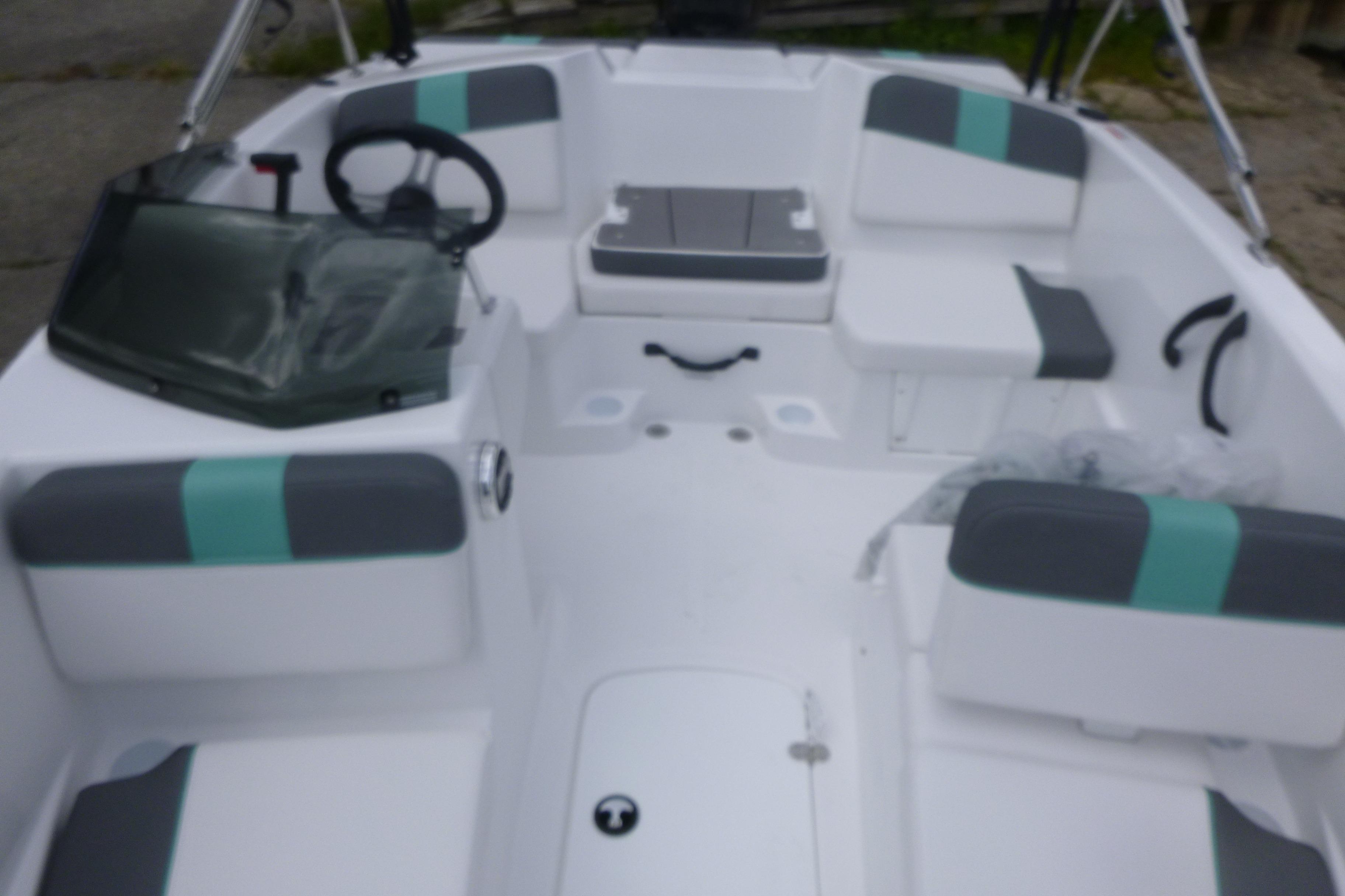 2026 Tahoe T16 boat interior with modern seating and steering wheel.