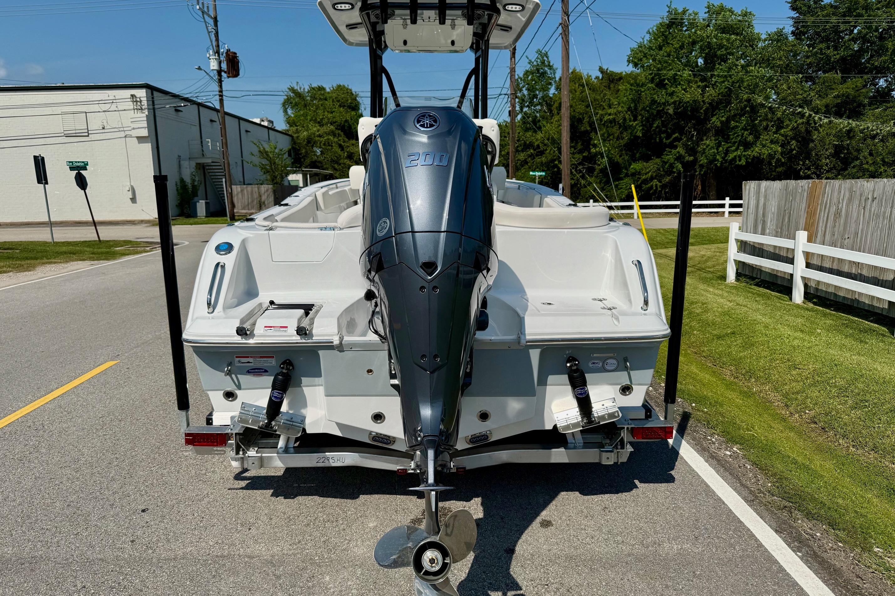 2026 Sea Hunt Ultra 229 boat with Yamaha 200 engine on a trailer.