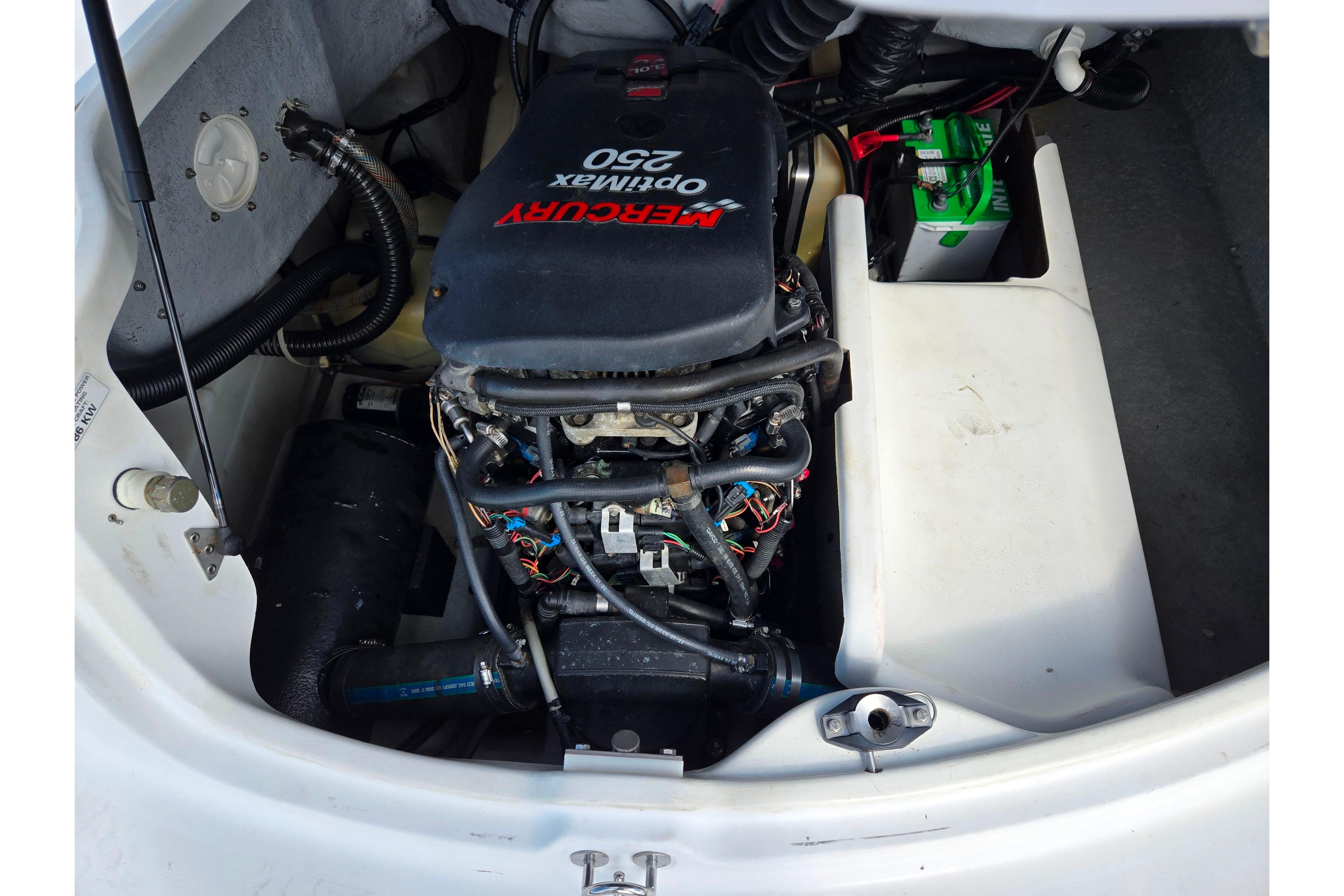 2004 Sea-Doo Islandia boat engine compartment with Mercury OptiMax 250 motor.