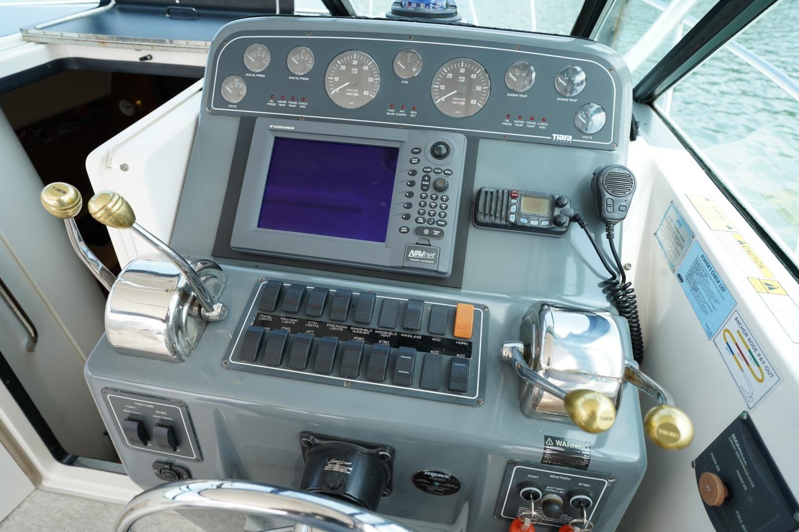 Helm of 2004 Tiara Yachts 2900 Open Classic with navigation controls and instruments.
