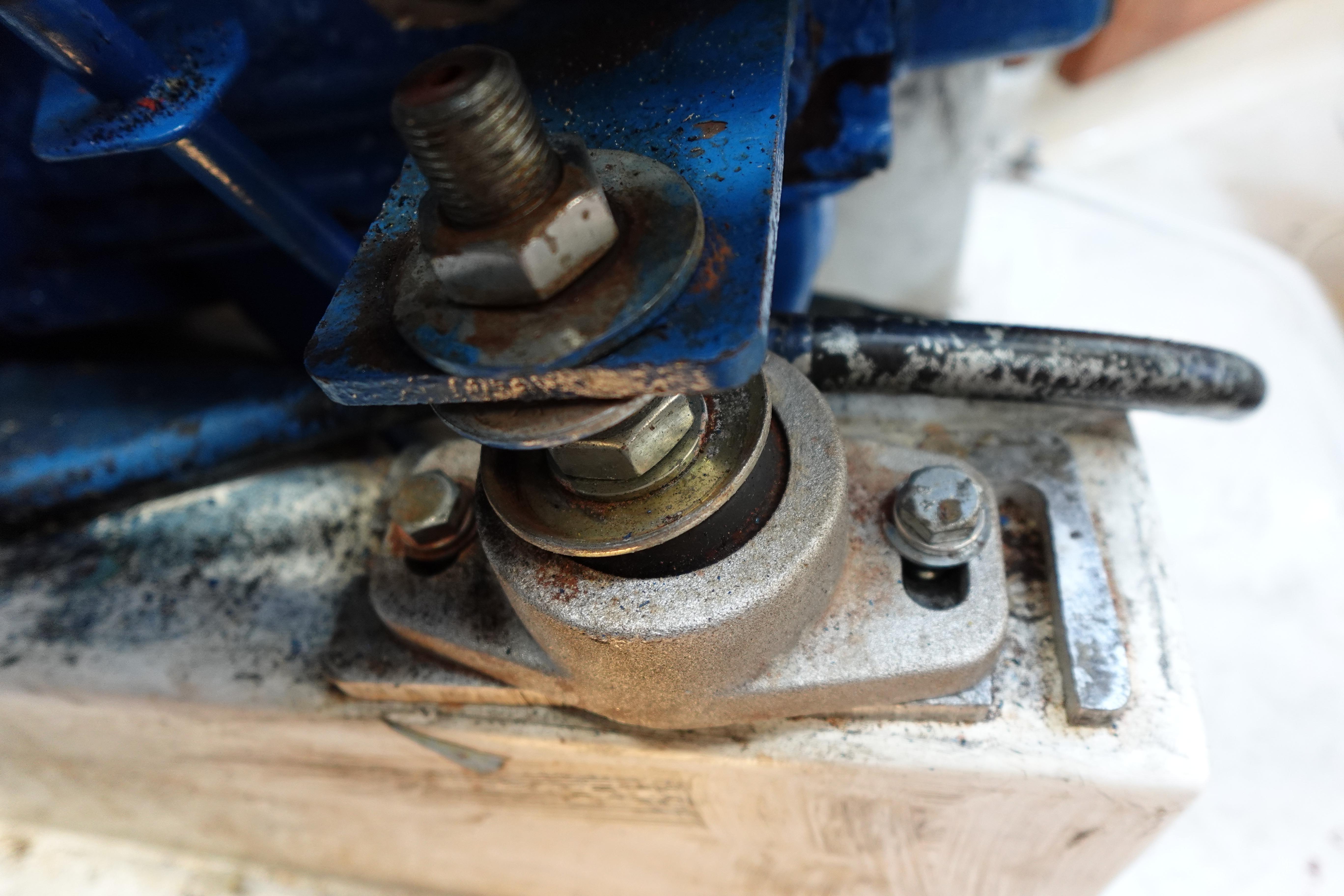 Close-up of a Catalina 28 sailboat engine mount, showing rust and wear.