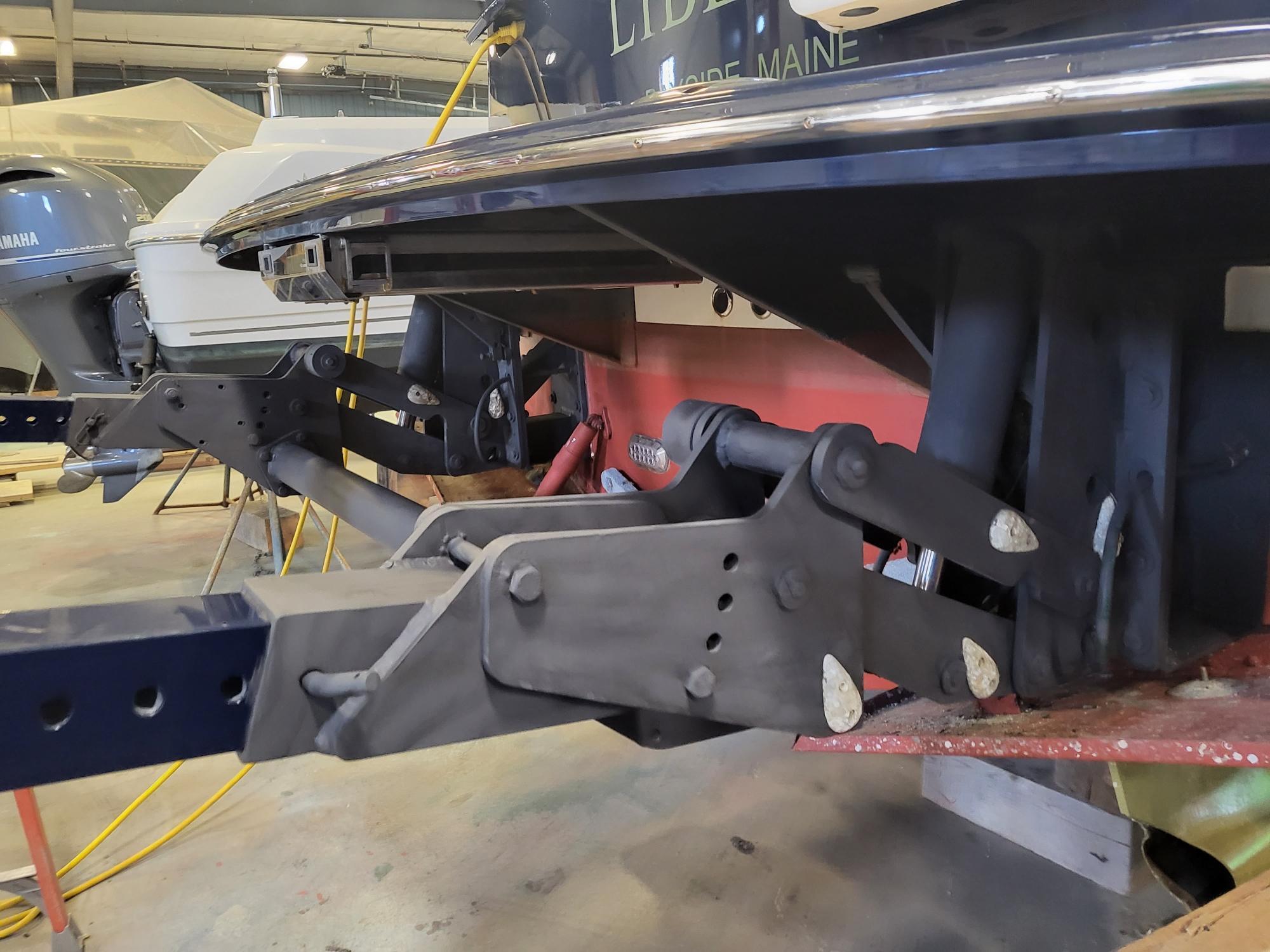 2013 MJM 40z Downeast boat trailer hitch in a garage setting.